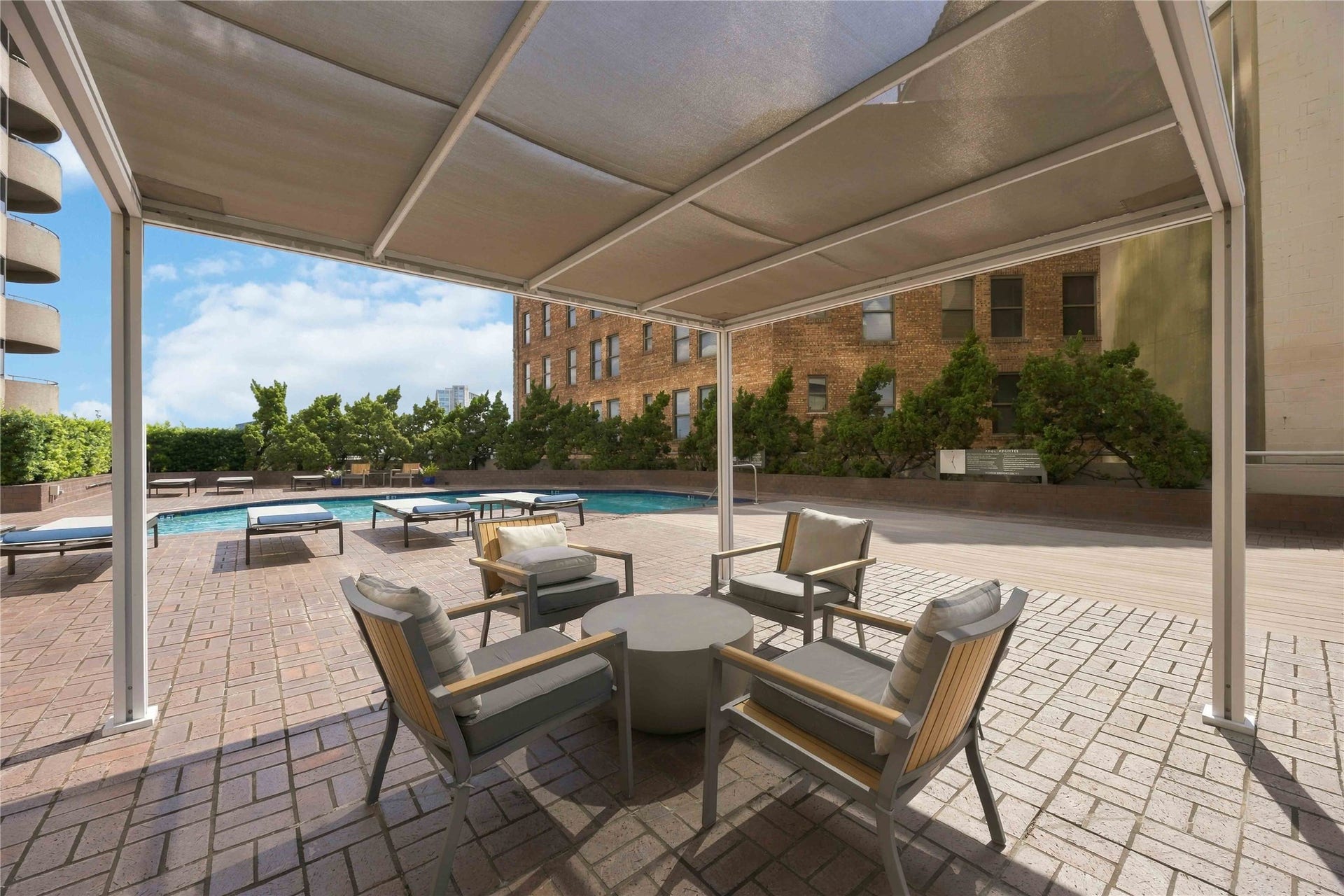 5000 Montrose Boulevard, #6A, Houston, TX 77006 A covered pergola by the pool provides shaded seating for relaxing or entertaining.