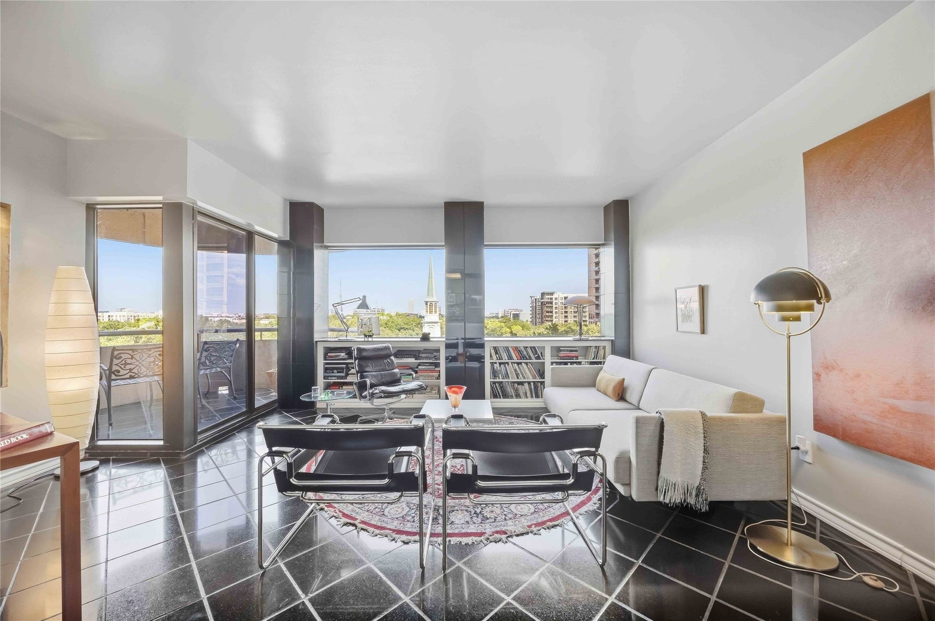5000 Montrose Boulevard, #6A, Houston, TX 77006 Floor-to-ceiling glass brings in treetop views and natural light all day.
