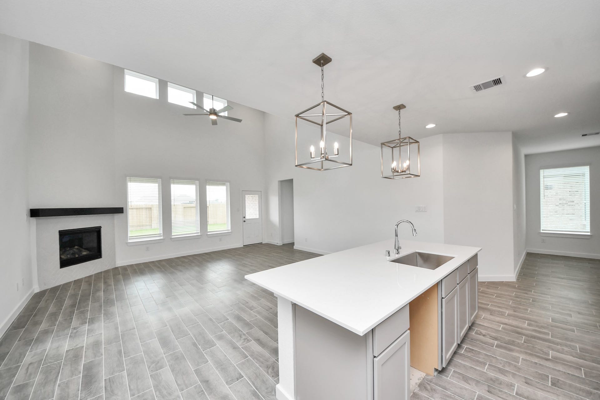 63 Knight Bayou Drive, Dayton, TX 77535 All of this overlooks your expansive family room, creating a perfect space for culinary delights and family gatherings. Sample photo of completed home with similar floor plan. Actual colors and selections may vary.