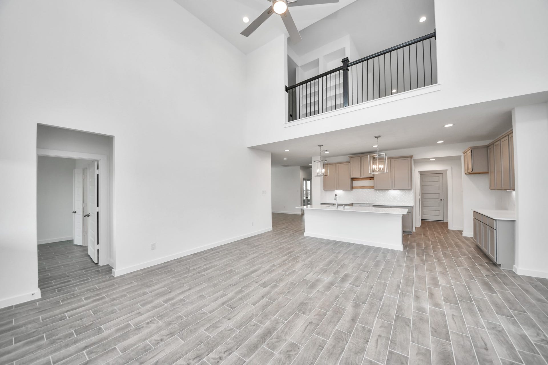63 Knight Bayou Drive, Dayton, TX 77535 Gather the family and guests together in your lovely living room! Featuring soaring high ceilings, recessed lighting, ceiling fan, custom paint, gorgeous floors, and large windows that provide plenty of natural lighting throughout the day. Sample photo of completed home with similar floor plan. Actual colors and selections may vary.