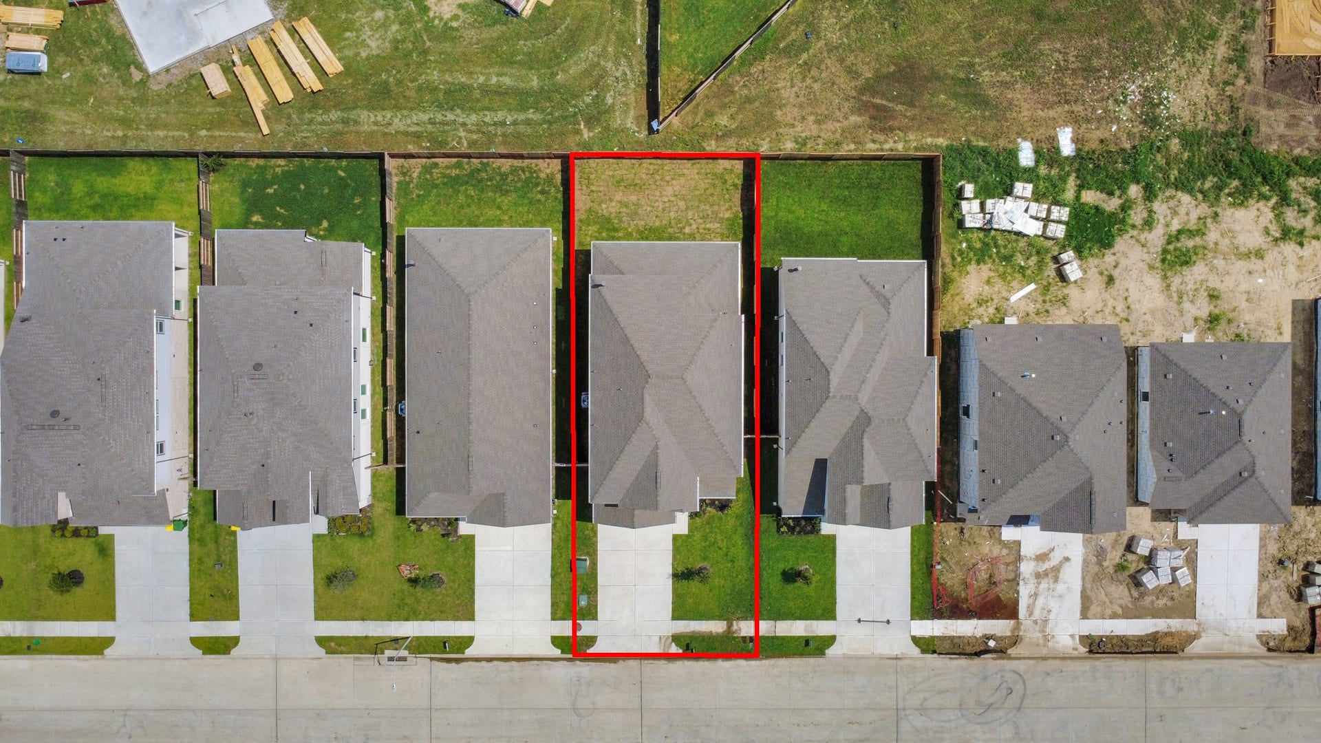 63 Knight Bayou Drive, Dayton, TX 77535 An aerial view of a spacious subdivision lot, highlighting a well-maintained yard and a fully fenced perimeter, offering both privacy and expansive outdoor space.