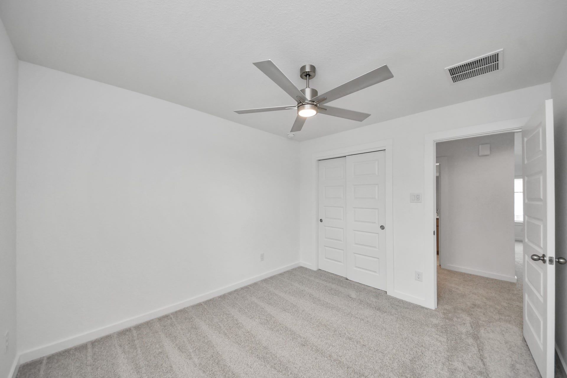 63 Knight Bayou Drive, Dayton, TX 77535 Generously sized secondary bedrooms featuring spacious closets, soft and inviting carpeting underfoot, large windows allowing plenty of natural light, and the added touch of privacy blinds for your personal retreat. Sample photo of completed home with similar floor plan. Actual colors and selections may vary.