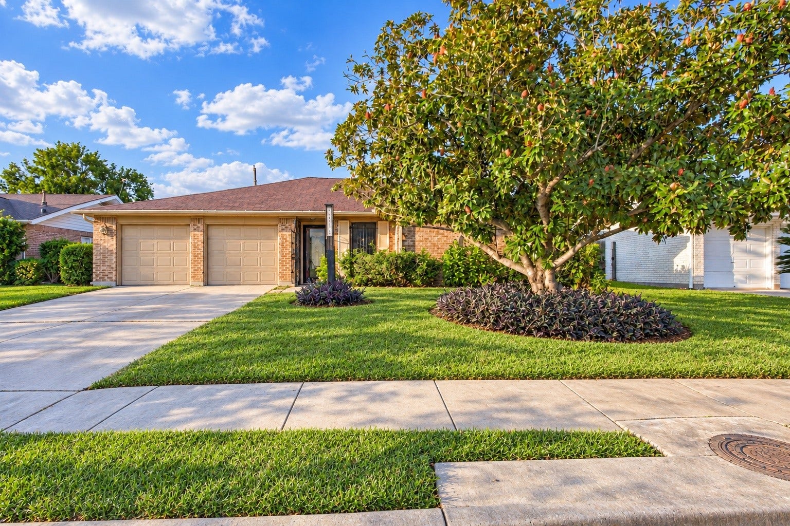 3914 Beran Drive, Houston, TX 77045 The exterior of the home - with a extra long driveway AND a two-car garage!