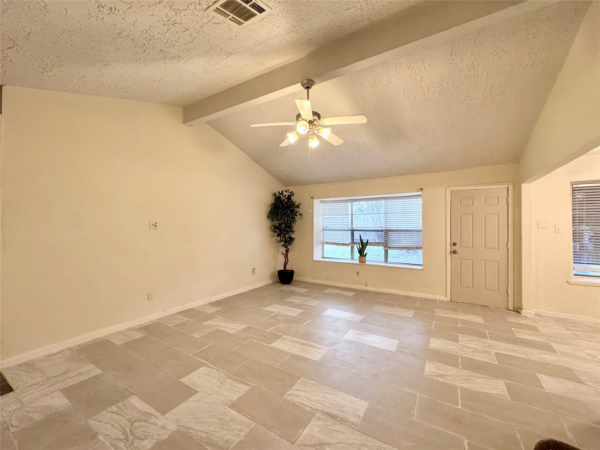 The large living room has high ceilings.The large living room has high ceilings.