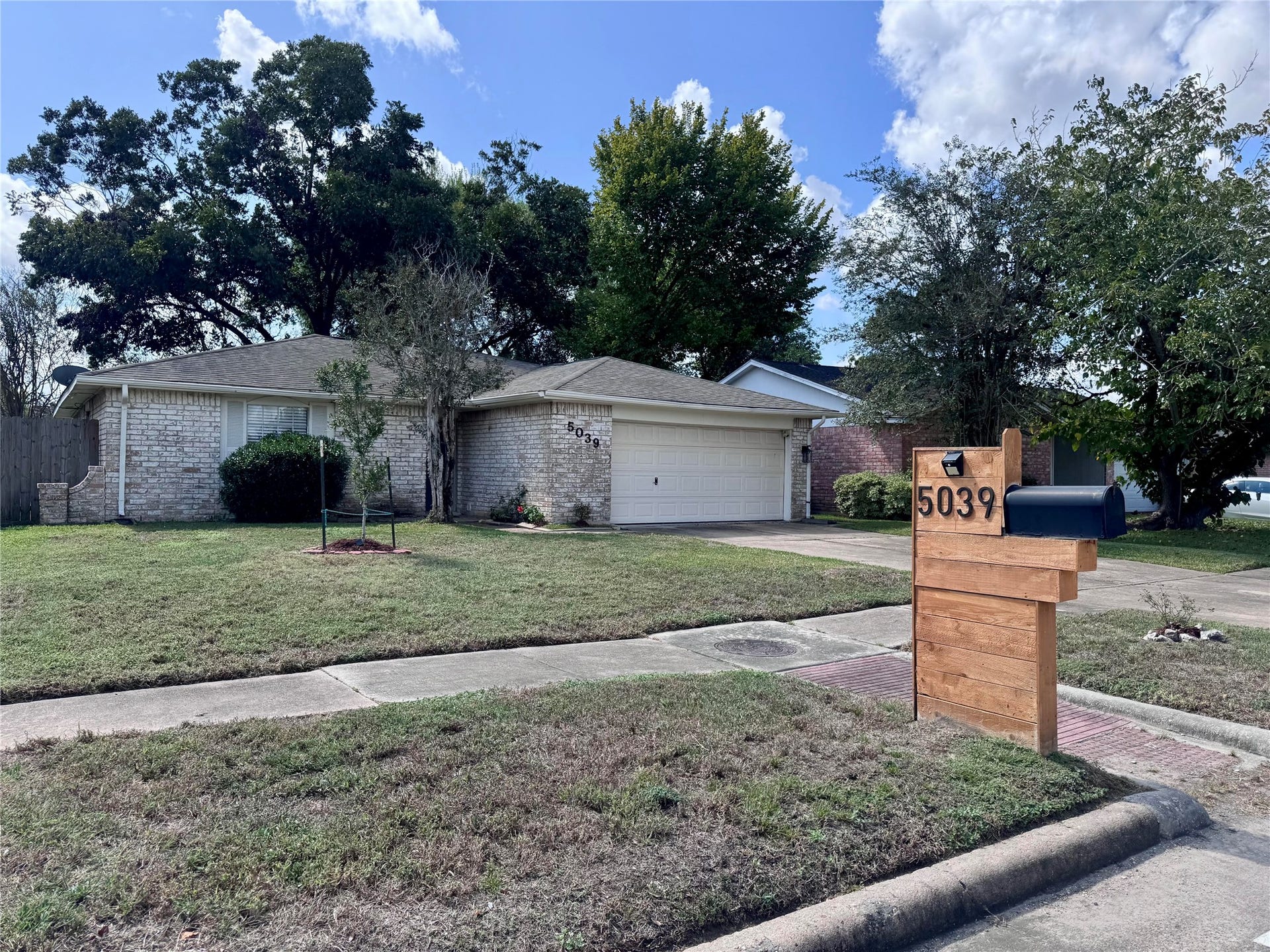 The home has a double-wide driveway and 2-car garage for plenty of parking.