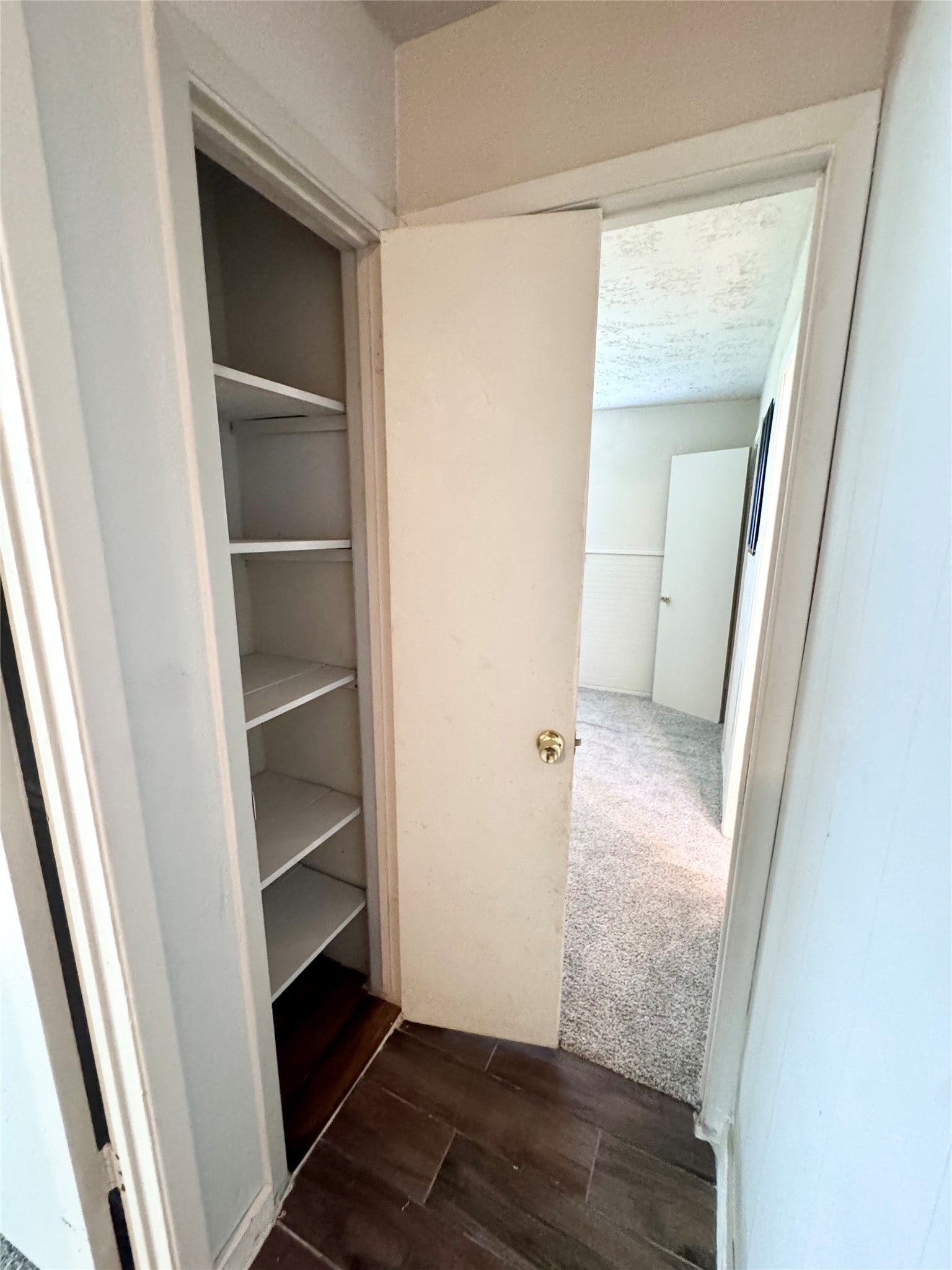 There is a linen closet located in the hallway.