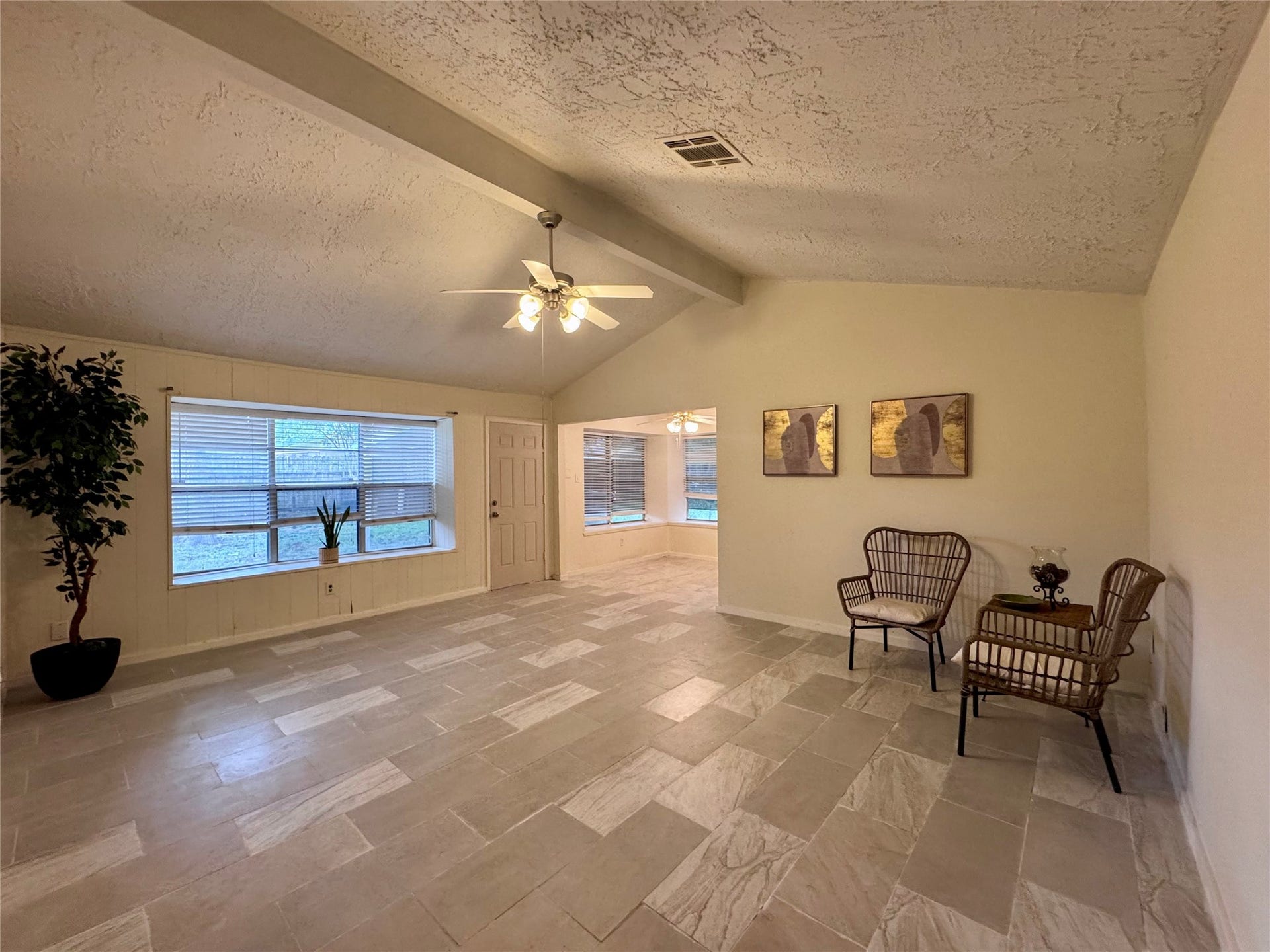 The large living room has high ceilings.