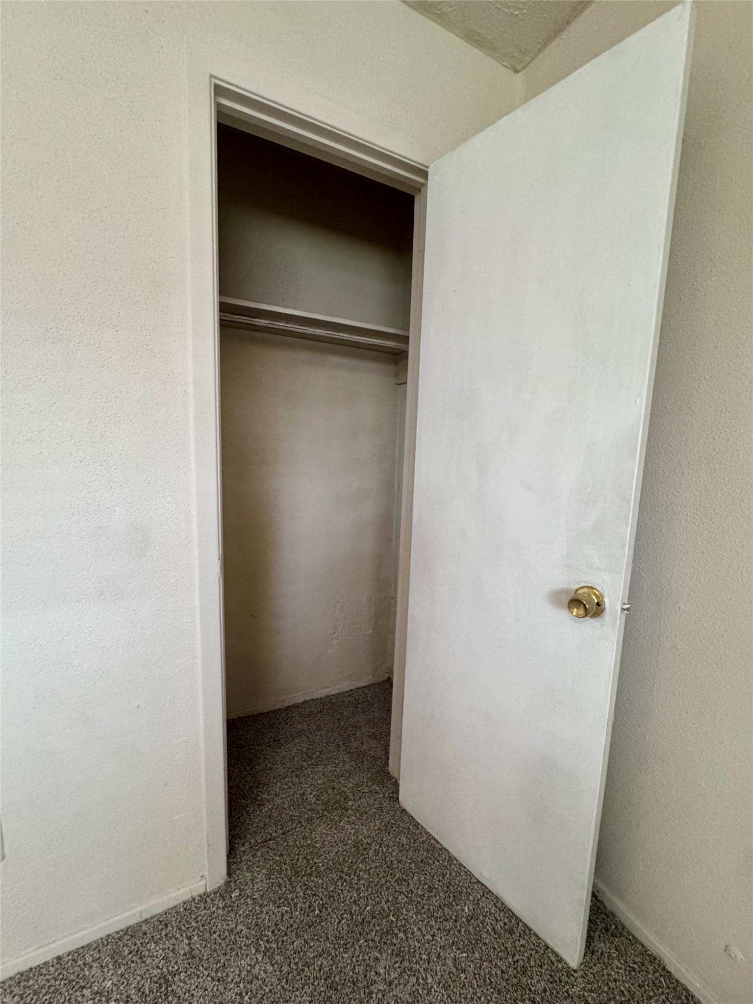 Primary bedroom has a secondary closet for additional storage space.