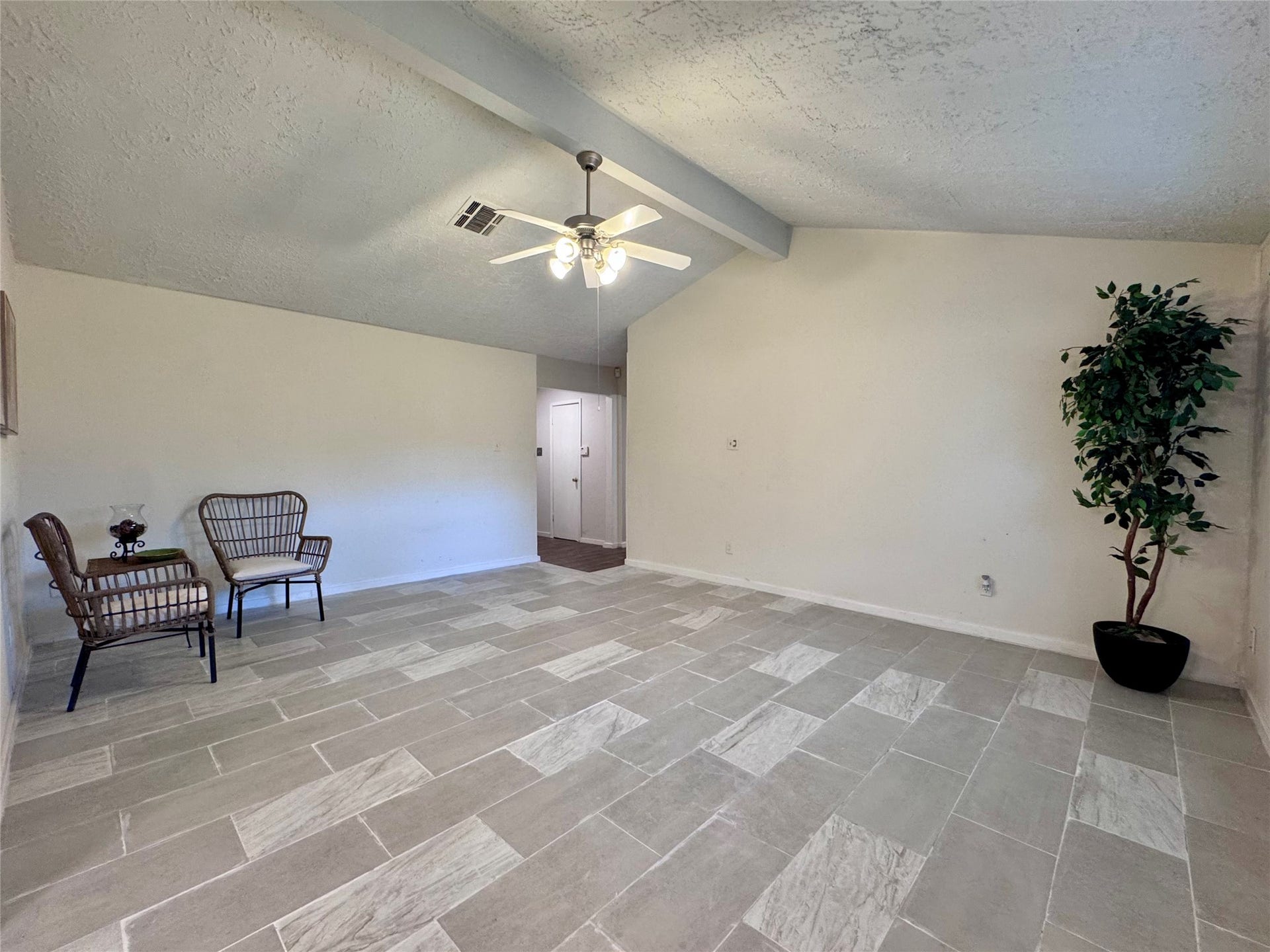 The large living room has high ceilings.The large living room has high ceilings.