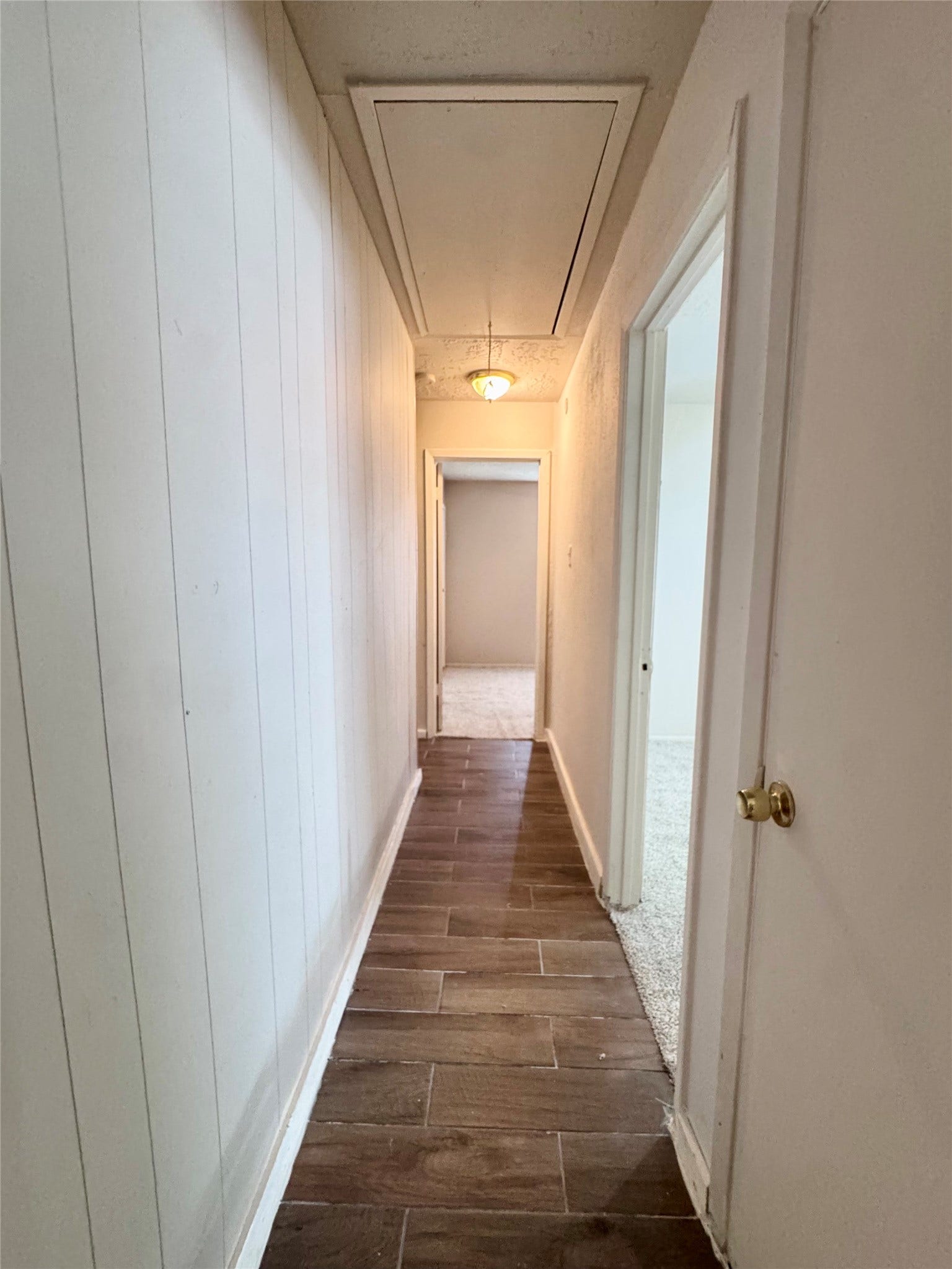 A view of the hallway from the primary bedroom.