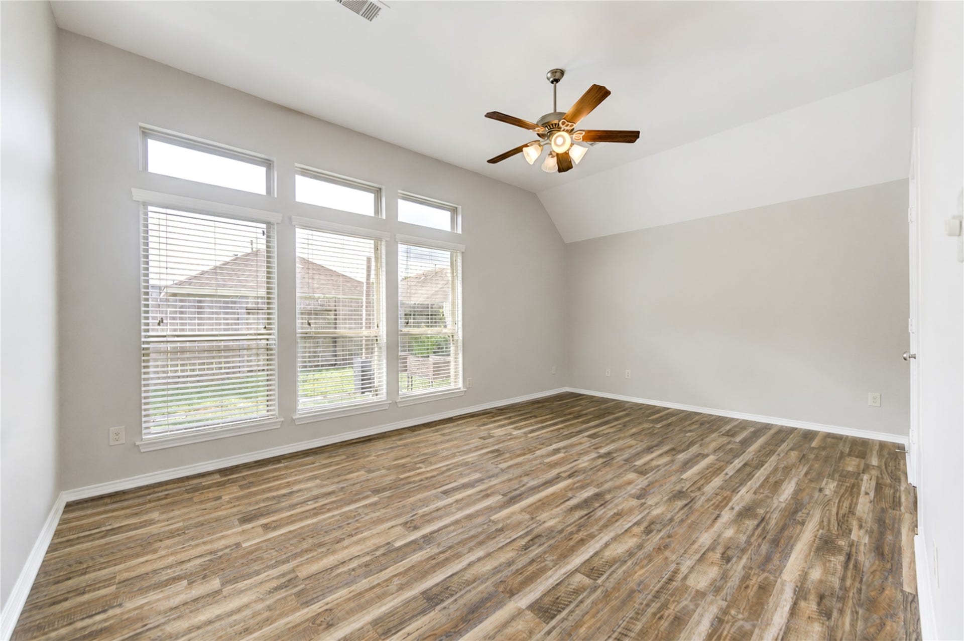 27407 Gatlin Lane, Spring, TX 77386 Expansive room with wood-look vinyl plank flooring and abundant natural light. Versatile enough for any lifestyle need.