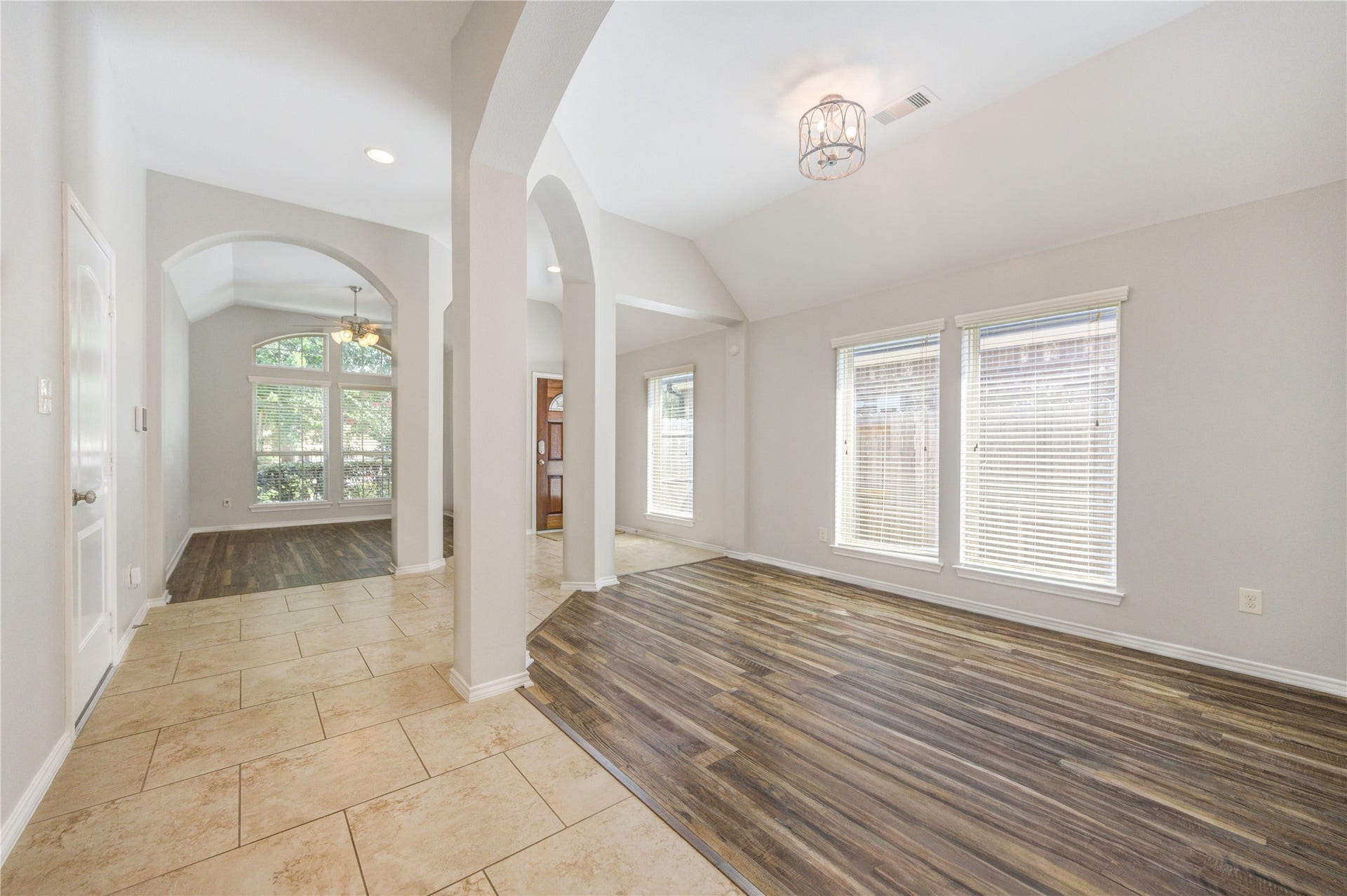 27407 Gatlin Lane, Spring, TX 77386 Expansive living space with gleaming wood-look vinyl plank flooring and abundant natural light. A versatile canvas ready for your personal touch.