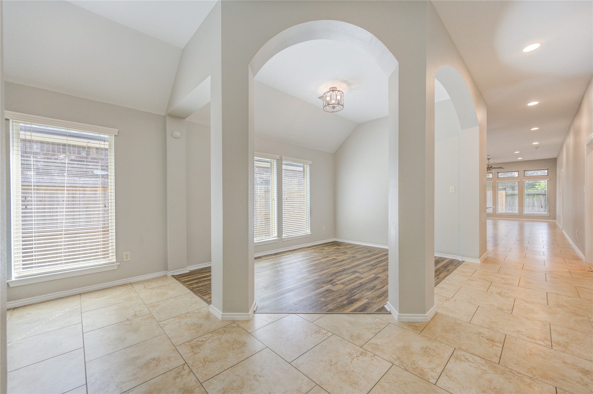 27407 Gatlin Lane, Spring, TX 77386 Elegant foyer with soaring ceilings, tall windows, and wood-look vinyl plank flooring. An entrance that truly impresses.