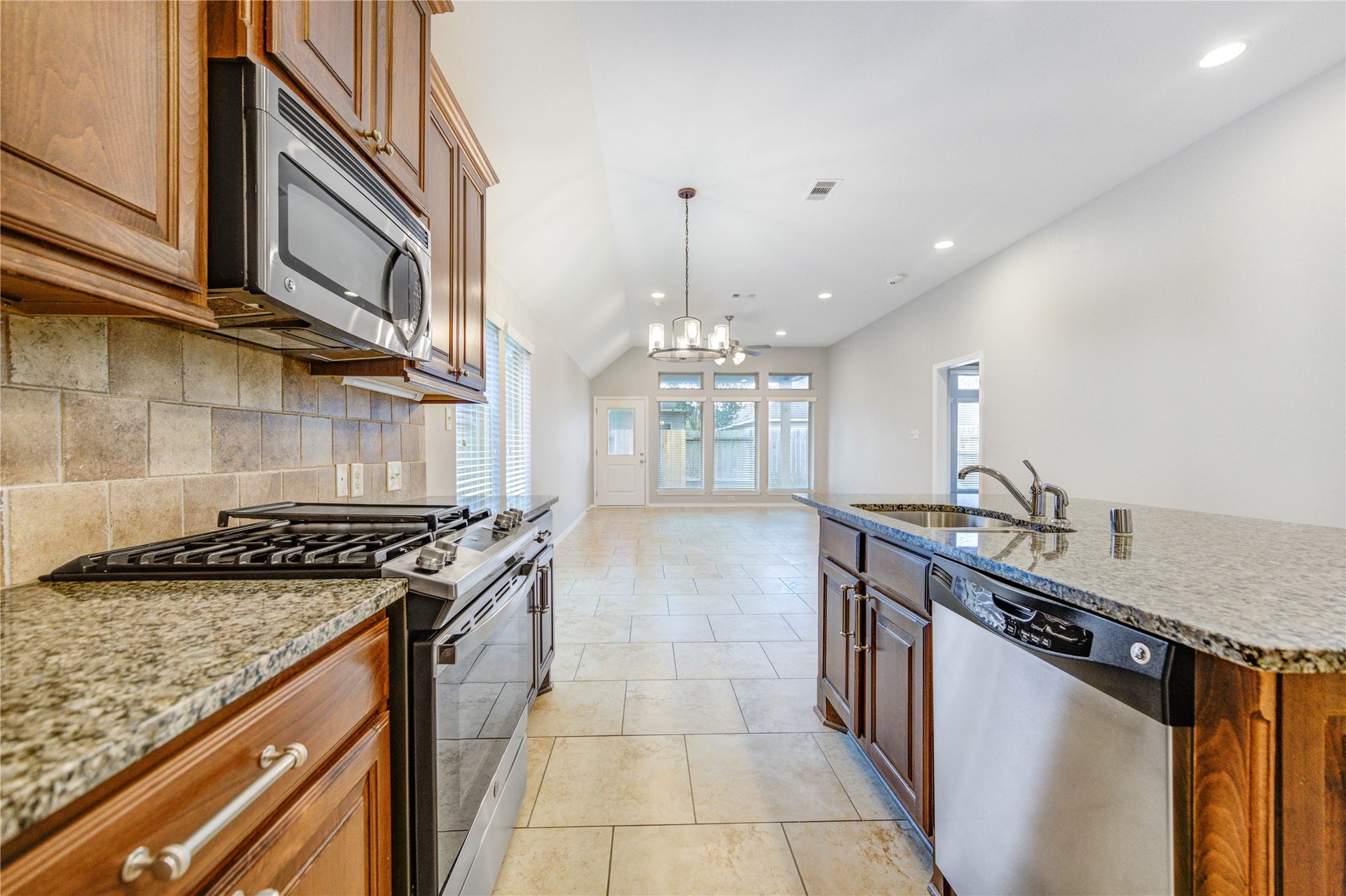 27407 Gatlin Lane, Spring, TX 77386 Stunning kitchen island with pendant lighting and stainless steel appliances. Designed to impress and built to last.