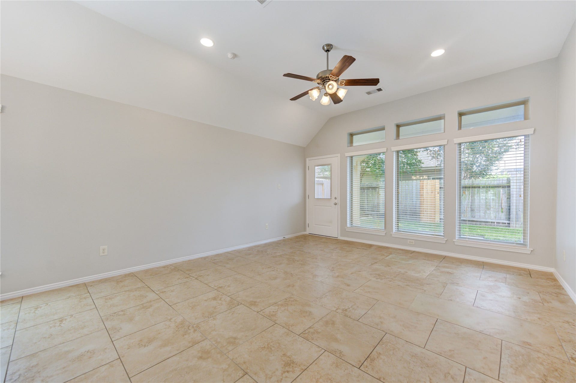 27407 Gatlin Lane, Spring, TX 77386 Light-filled room with soft carpet and generous windows. Comfortable and inviting in every season.