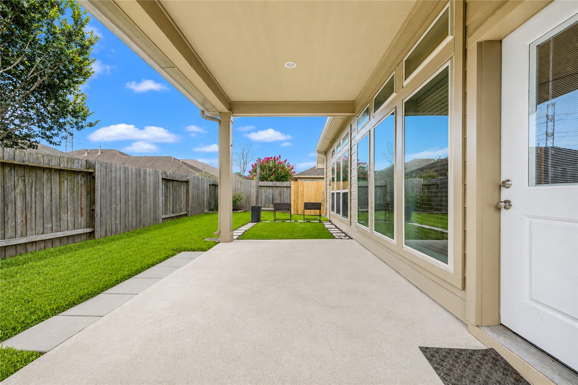 27407 Gatlin Lane, Spring, TX 77386 Covered patio opens to a green, fenced backyard. A seamless flow for entertaining.