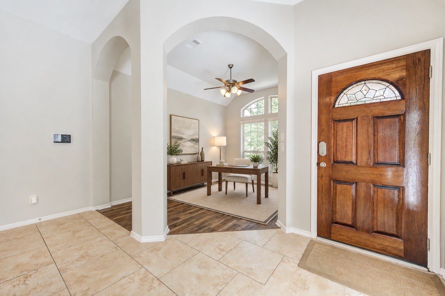 27407 Gatlin Lane, Spring, TX 77386 Grand entryway welcomes you with an elegant wood front door and arched architectural details. A warm first impression for every guest.