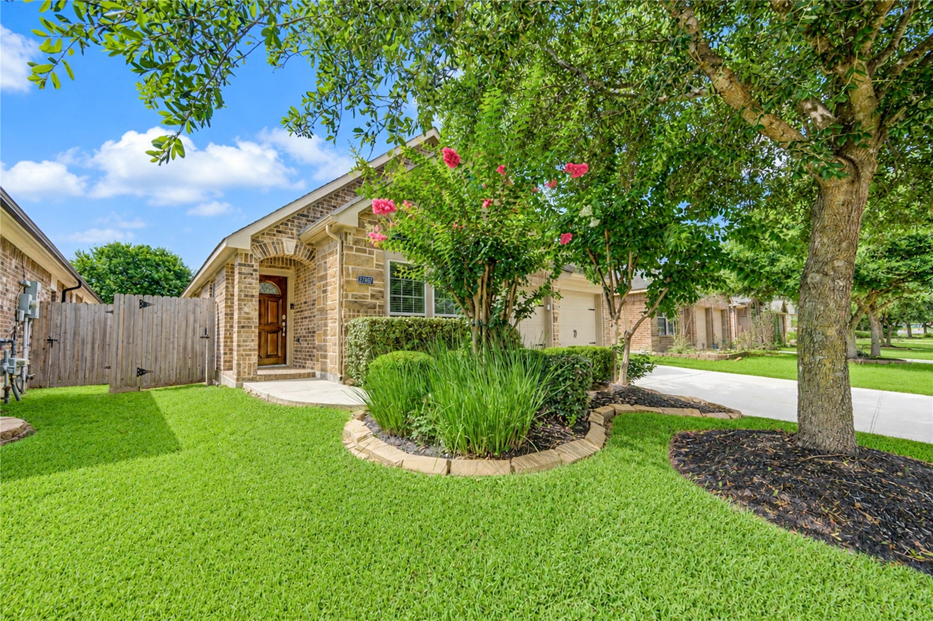 27407 Gatlin Lane, Spring, TX 77386 Beautifully landscaped backyard surrounds the home with lush greenery. A picturesque outdoor setting to enjoy year-round.