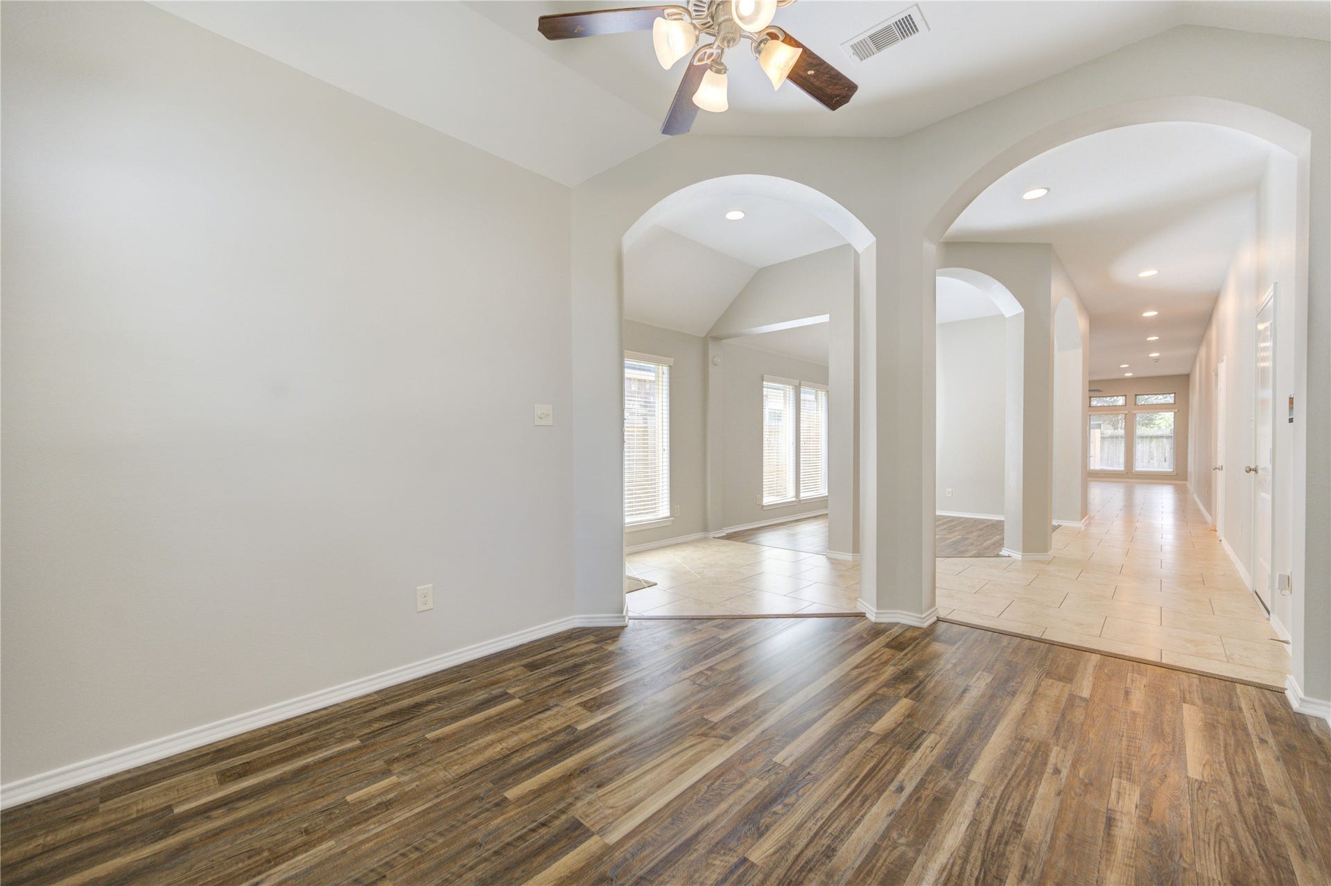 27407 Gatlin Lane, Spring, TX 77386 Wood-look vinyl plank flooring and an arched doorway add timeless character to this hallway. Craftsmanship shines throughout.