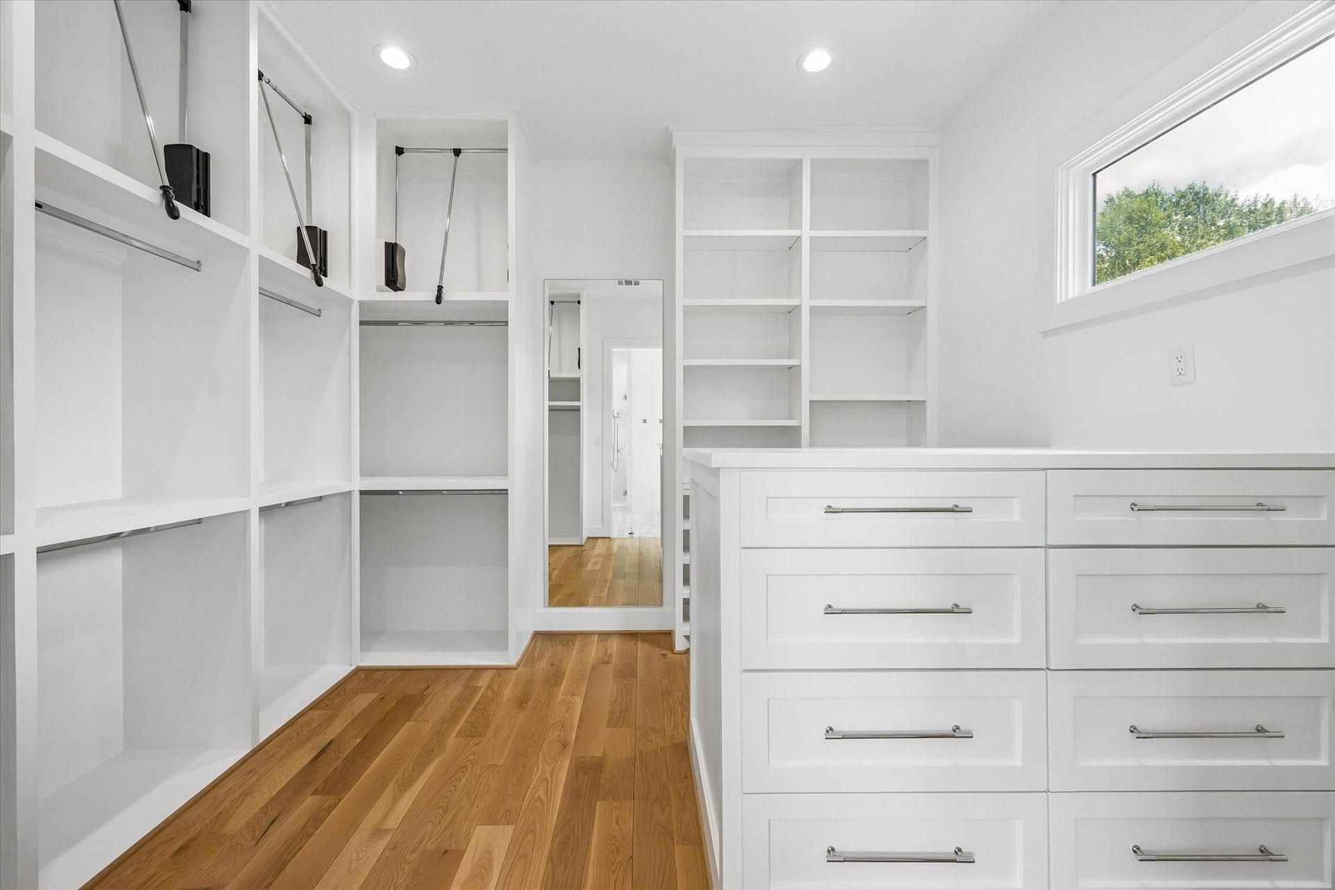 704 Teetshorn Street, Houston, TX 77009 Well-appointed second-floor utility room with deep green cabinetry, brass hardware, sink and ample storage.