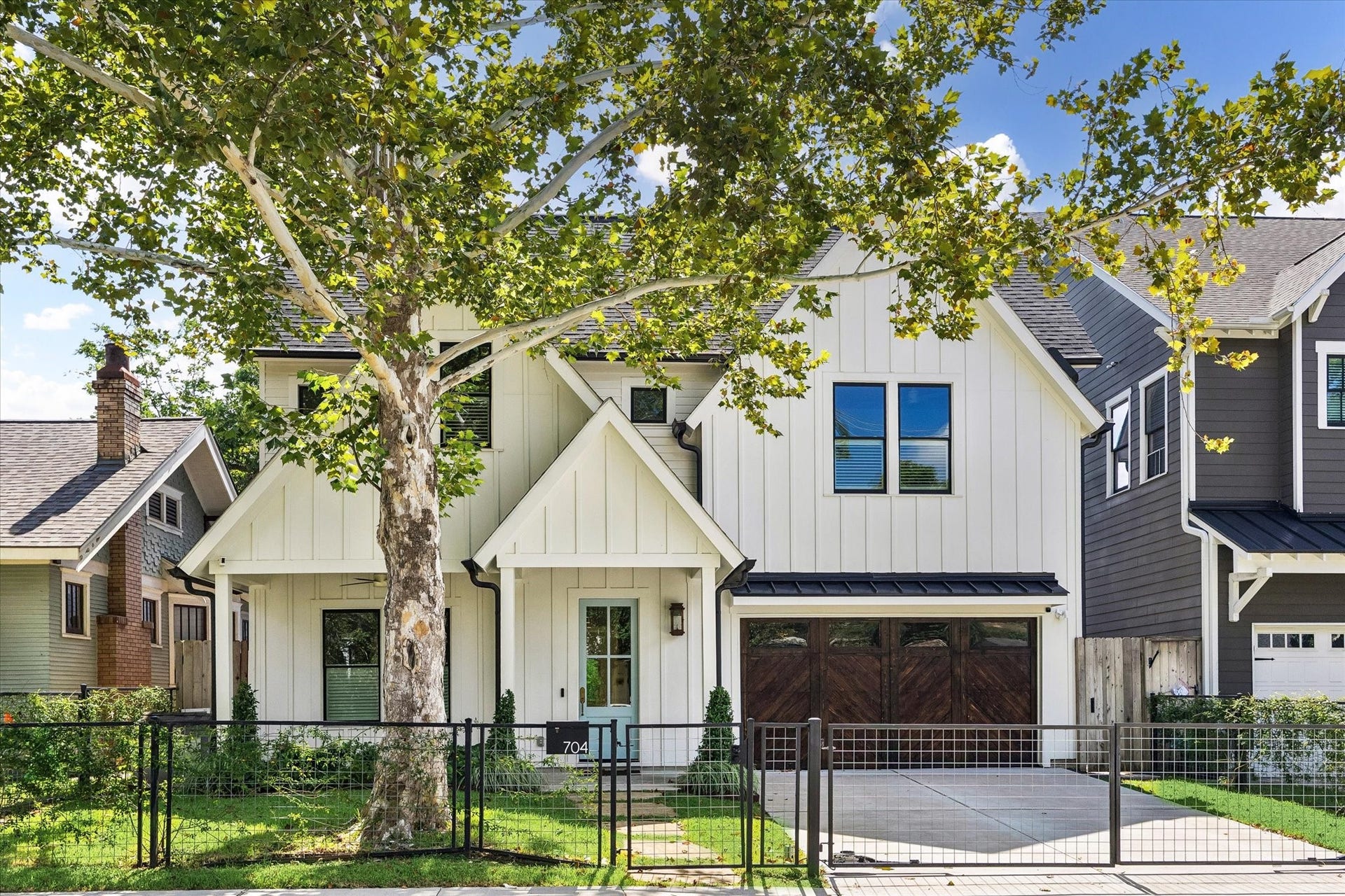 704 Teetshorn Street, Houston, TX 77009 A gated front entry, attached garage and welcoming covered porch create a polished first impression.