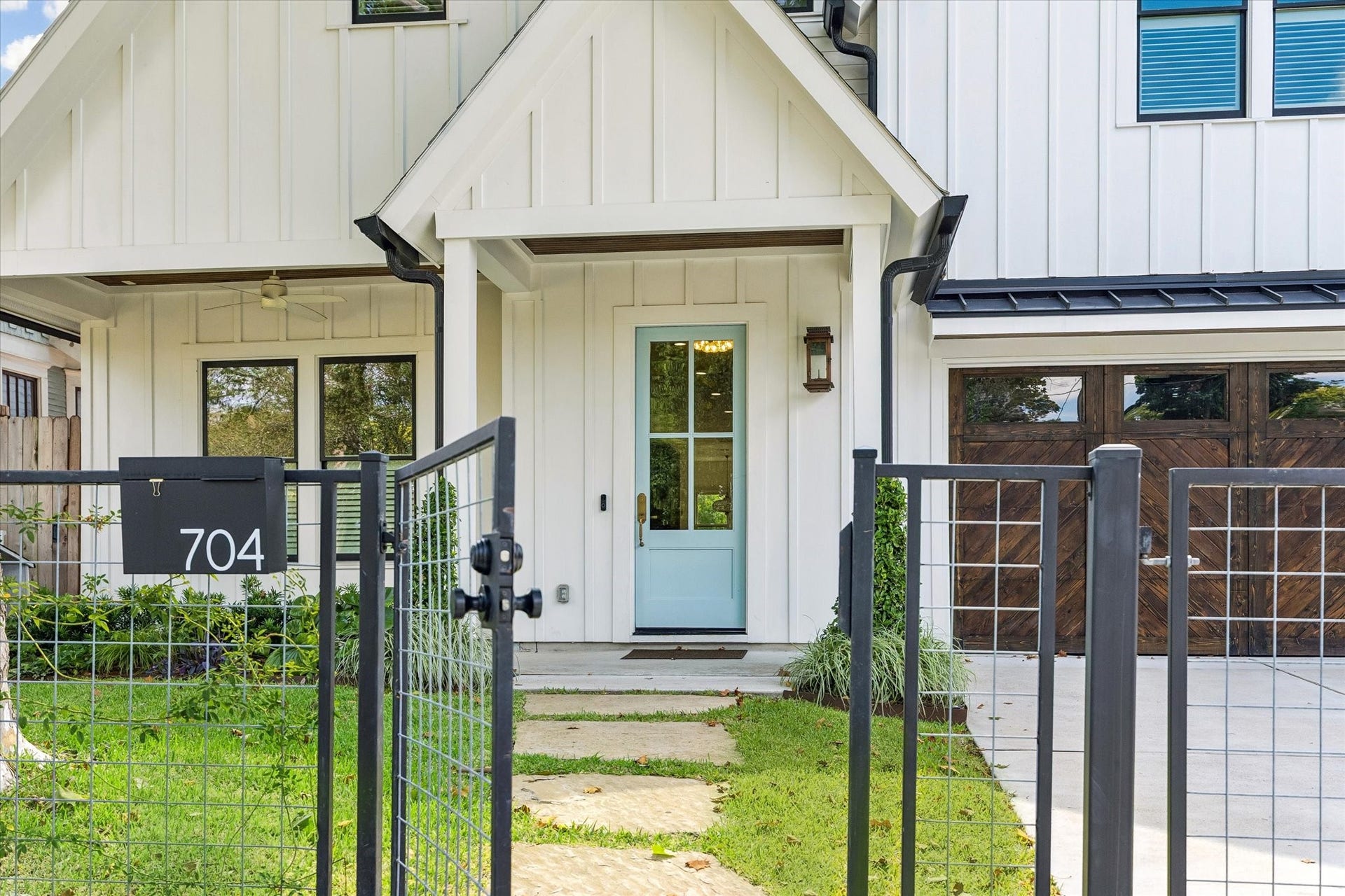 704 Teetshorn Street, Houston, TX 77009 A gated front entry, attached garage and welcoming covered porch create a polished first impression.