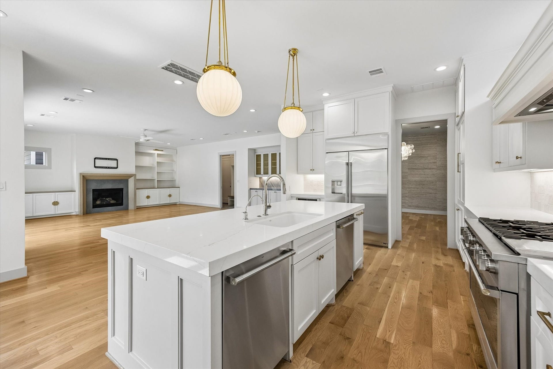 704 Teetshorn Street, Houston, TX 77009 Another view highlights the oversized island, extensive cabinetry and seamless connection to the living room and dining area.