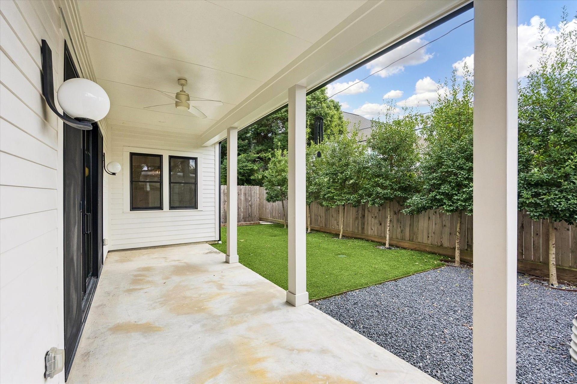 704 Teetshorn Street, Houston, TX 77009 Covered rear patio creates a shaded outdoor living area directly off the main living space.