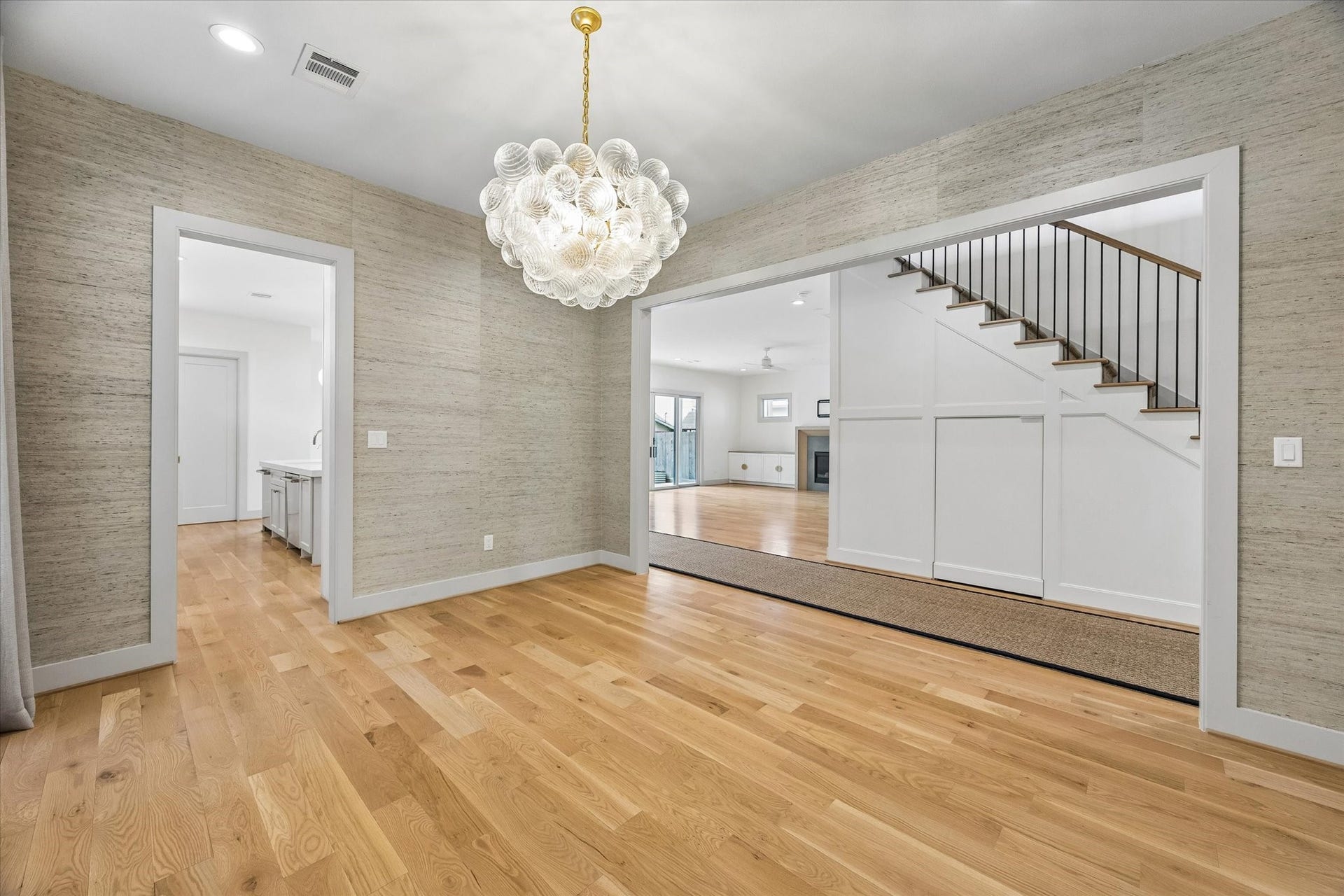 704 Teetshorn Street, Houston, TX 77009 The dining room opens broadly to the main living area, creating an easy connection for everyday living and entertaining.