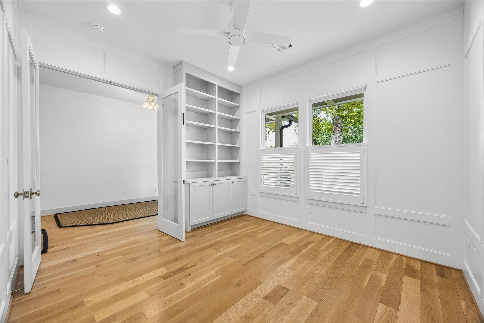 704 Teetshorn Street, Houston, TX 77009 French doors open to the study, which features built-in shelving and cabinetry for added function and storage.