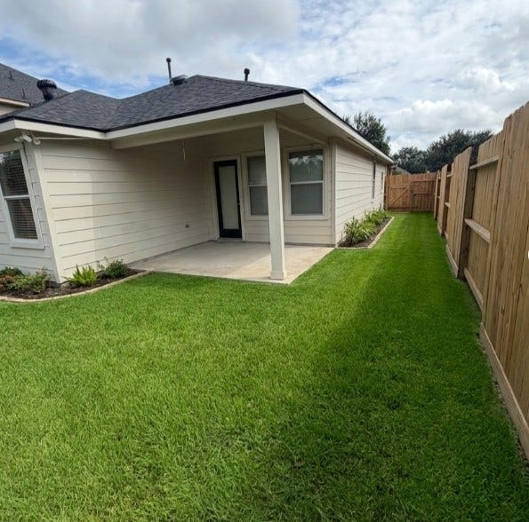 21723 Saragosa Pond Lane, Spring, TX 77379 Charming backyard with lush lawn and delightful curb appeal.
