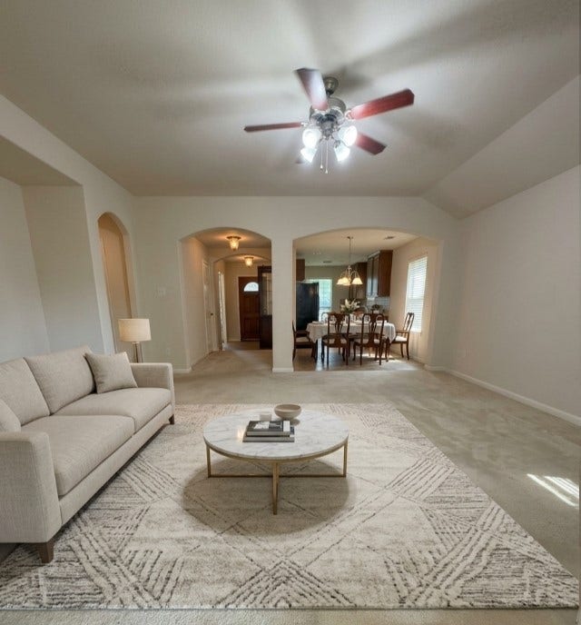 21723 Saragosa Pond Lane, Spring, TX 77379 Experience the spacious charm of this beautifully staged living room, seamlessly flowing into the dining area, perfect for entertaining and relaxation.