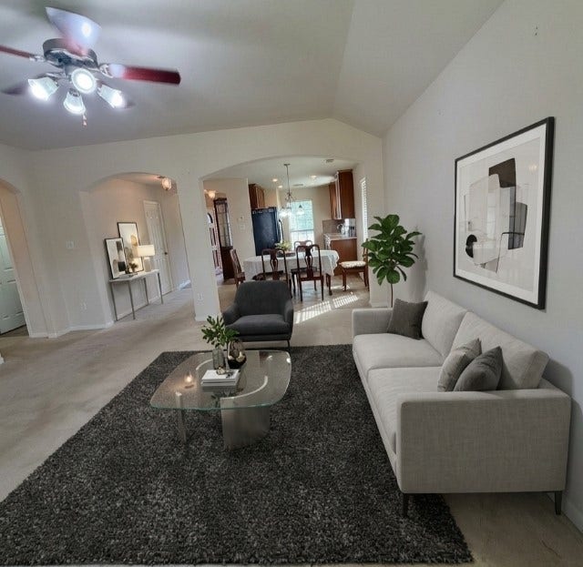 21723 Saragosa Pond Lane, Spring, TX 77379 Stylishly staged living room showcasing a bright, open layout perfect for relaxation and entertaining.