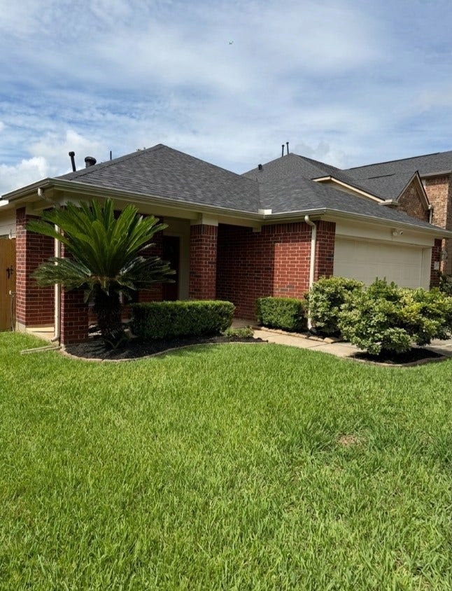 21723 Saragosa Pond Lane, Spring, TX 77379 Charming entrance with manicured lawn and delightful curb appeal.
