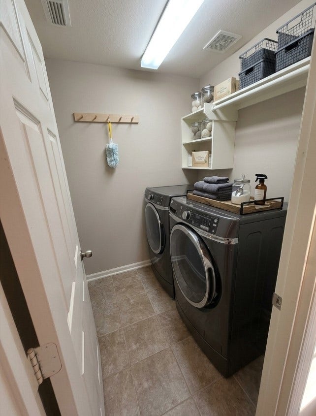 21723 Saragosa Pond Lane, Spring, TX 77379 Efficiently designed laundry room equipped with modern appliances, ample shelving, and convenient storage solutions.