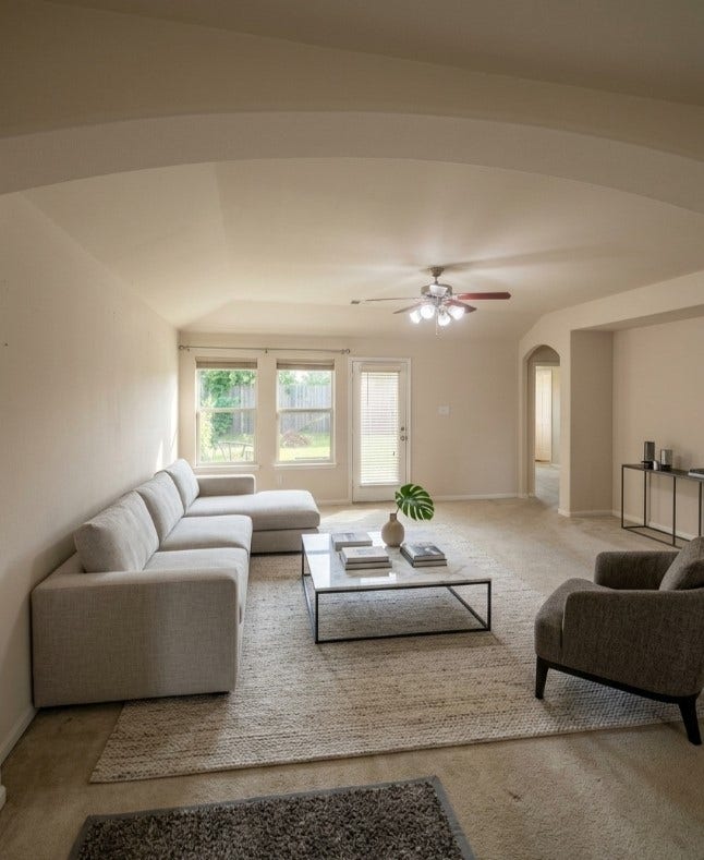 21723 Saragosa Pond Lane, Spring, TX 77379 Spacious living room featuring elegant virtual staging, highlighting its bright, inviting atmosphere and potential for stylish comfort.