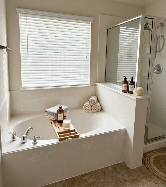 21723 Saragosa Pond Lane, Spring, TX 77379 Luxurious primary bath featuring a spacious soaking tub, elegant fixtures, and a bright, serene atmosphere perfect for relaxation.
