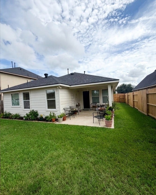 21723 Saragosa Pond Lane, Spring, TX 77379 Charming backyard with a lush lawn, perfect for relaxation and enjoying outdoor living.