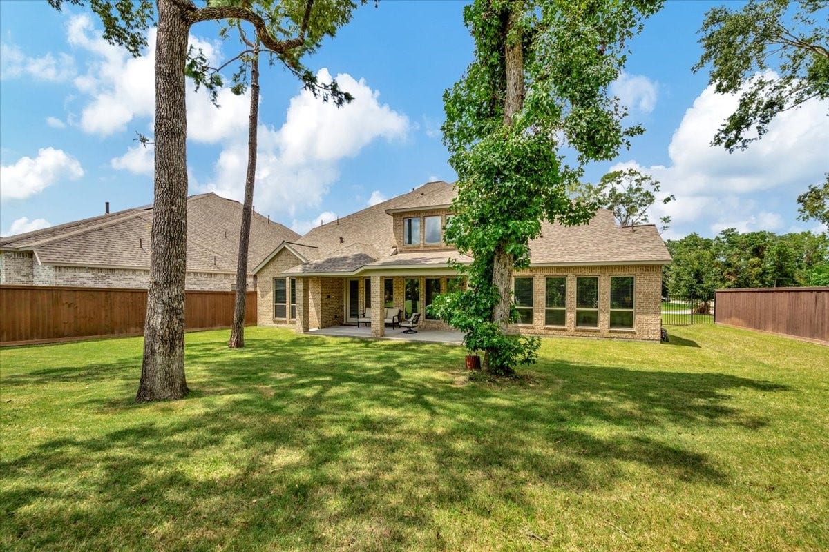12218 Hickory Arroyo Drive, Humble, TX 77346 Expansive backyard perfect for a pool, offering endless possibilities for outdoor living and entertainment.