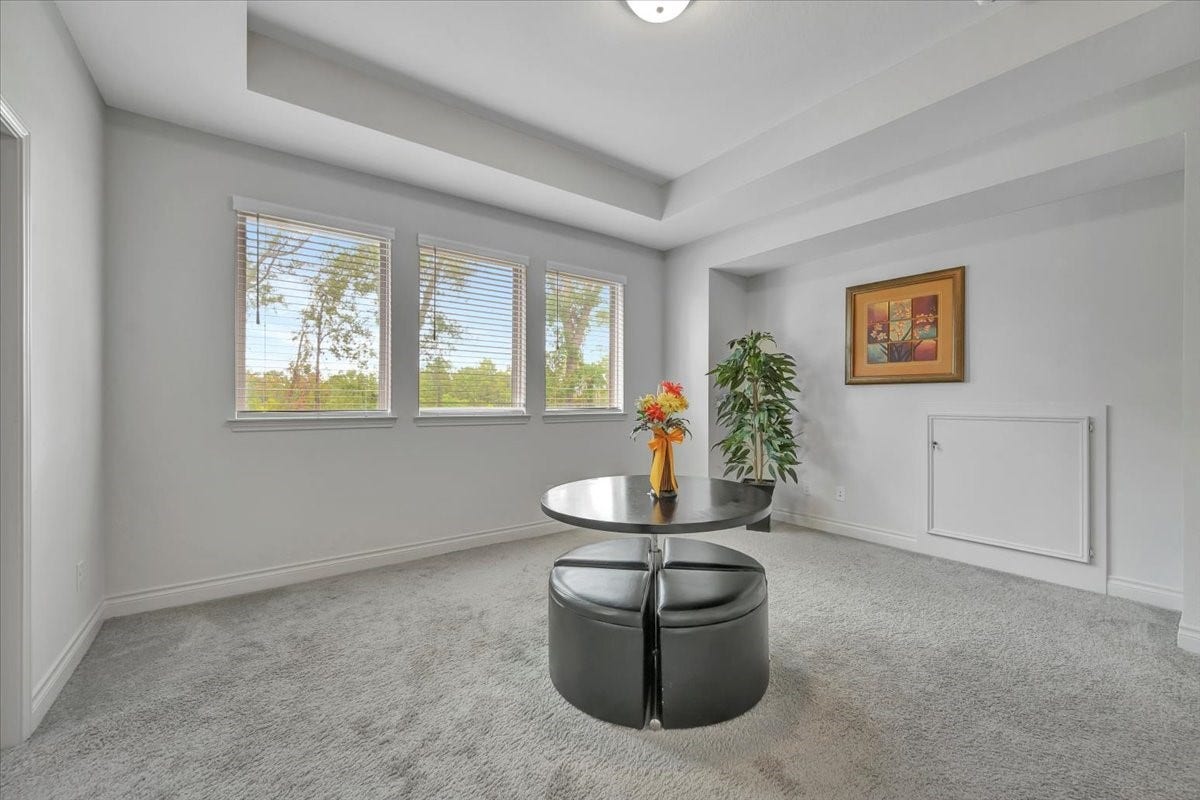 12218 Hickory Arroyo Drive, Humble, TX 77346 Discover endless fun in this spacious upstairs gameroom, filled with natural light and perfect for entertainment.