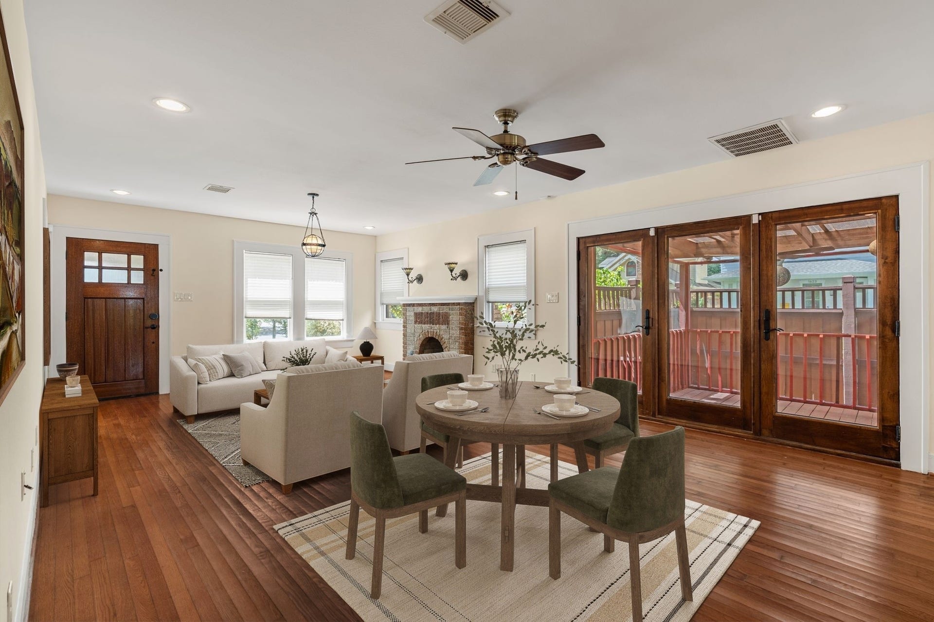 The dining space has easy access to the wrap around deck.  Virtually staged.