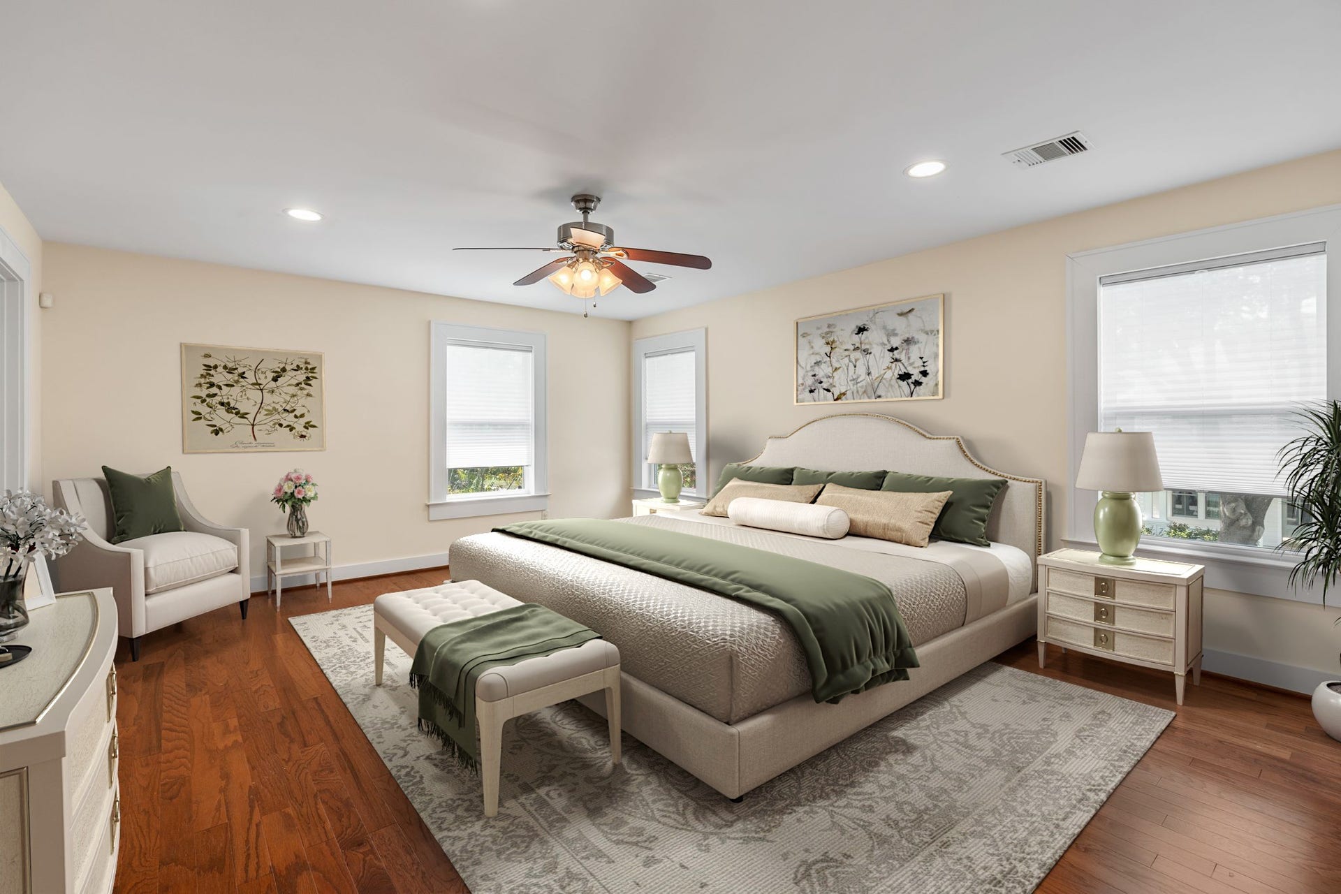 Spacious primary bedroom features a walk-in closet, wood floors and recessed lighting.  Virtually staged
