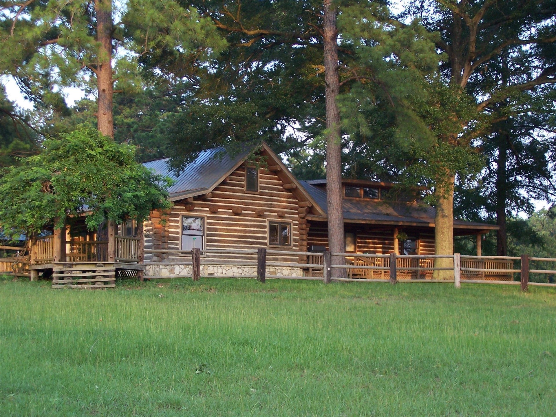 3920 Spring Branch Road, Montgomery, TX 77316 Front and side view of the log cabin.