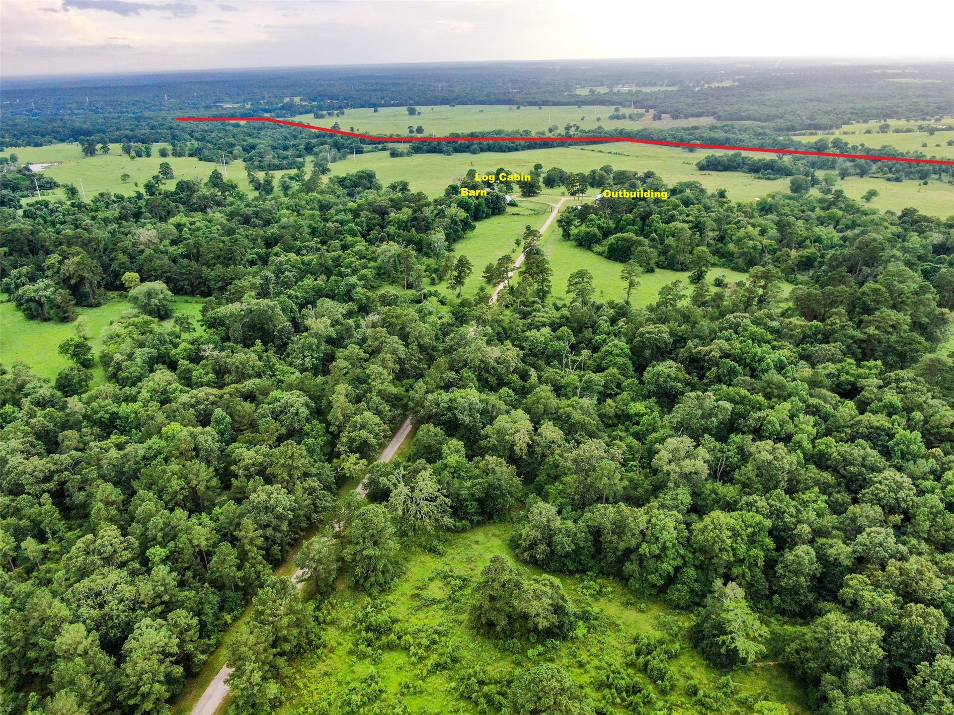 3920 Spring Branch Road, Montgomery, TX 77316 Log Cabin, Barn with stalls/tack room/turnouts, outbuilding (storage, open air area used for events) and workshop area.