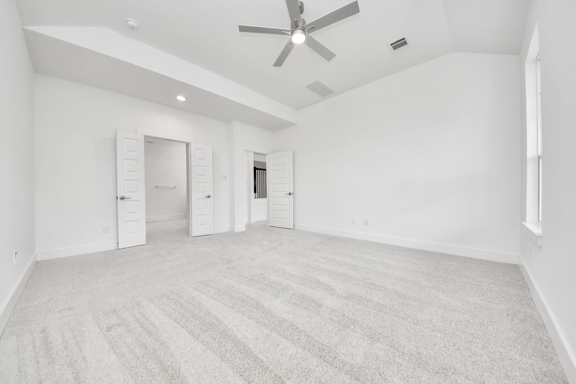 3221 Skerne Spring Drive, Spring, TX 77373 Come and unwind after a long day in this magnificent primary suite! This spacious room features plush carpet, warm paint, high ceilings and large windows with privacy blinds. Sample photo of completed home with similar floor plan. Actual colors and selections may vary.