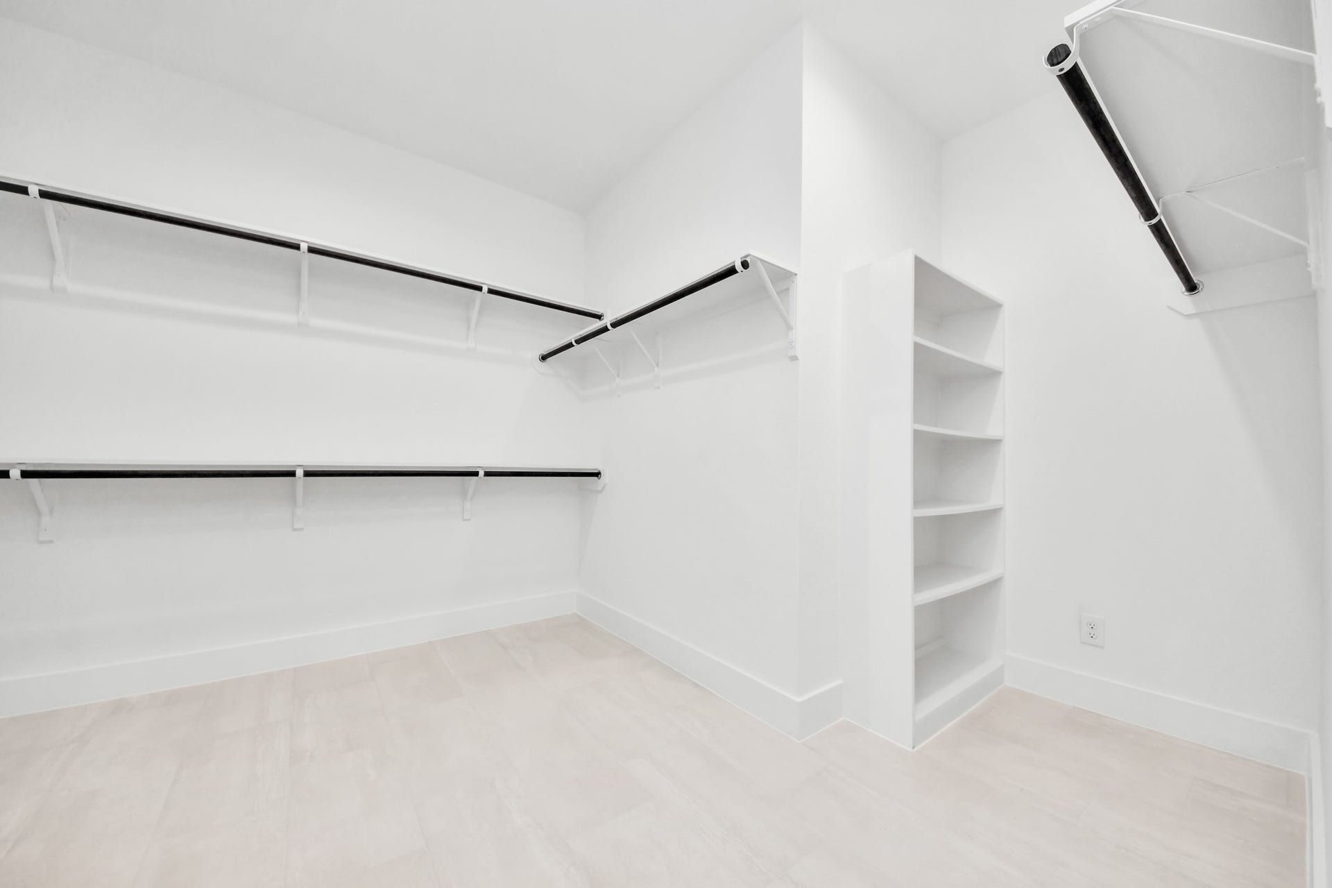 3221 Skerne Spring Drive, Spring, TX 77373 Walk-in closet that epitomizes luxury and practicality. This generously sized space features built-in shelving, offering abundant room for impeccable organization. High ceilings and recessed lighting create a bright and welcoming ambiance. Sample photo of completed home with similar floor plan. Actual colors and selections may vary.