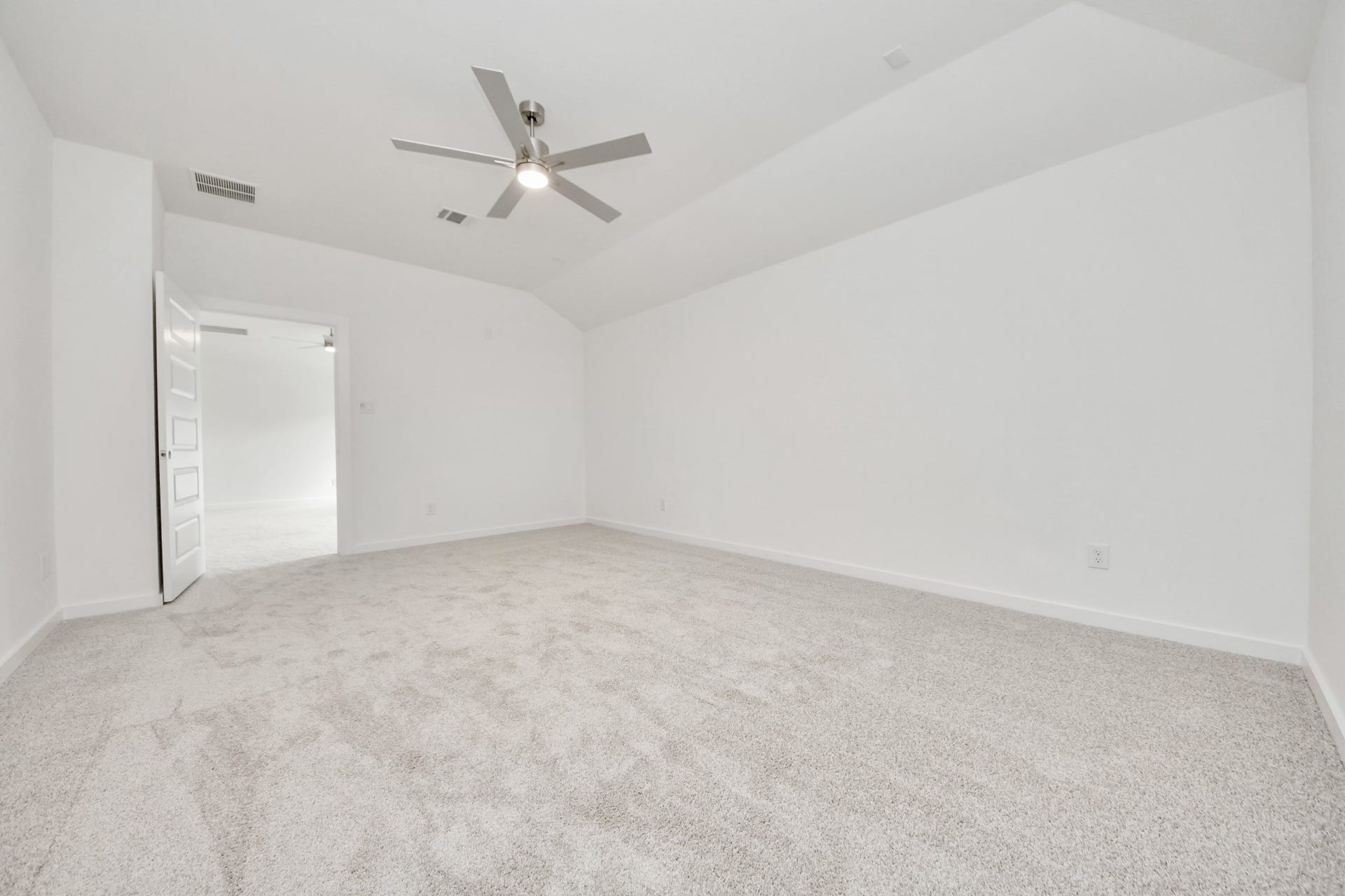3221 Skerne Spring Drive, Spring, TX 77373 Secondary bedroom features plush carpeting, large windows that let in plenty of natural light, bright paint, and spacious closets. Sample photo of completed home with similar floor plan. Actual colors and selections may vary.