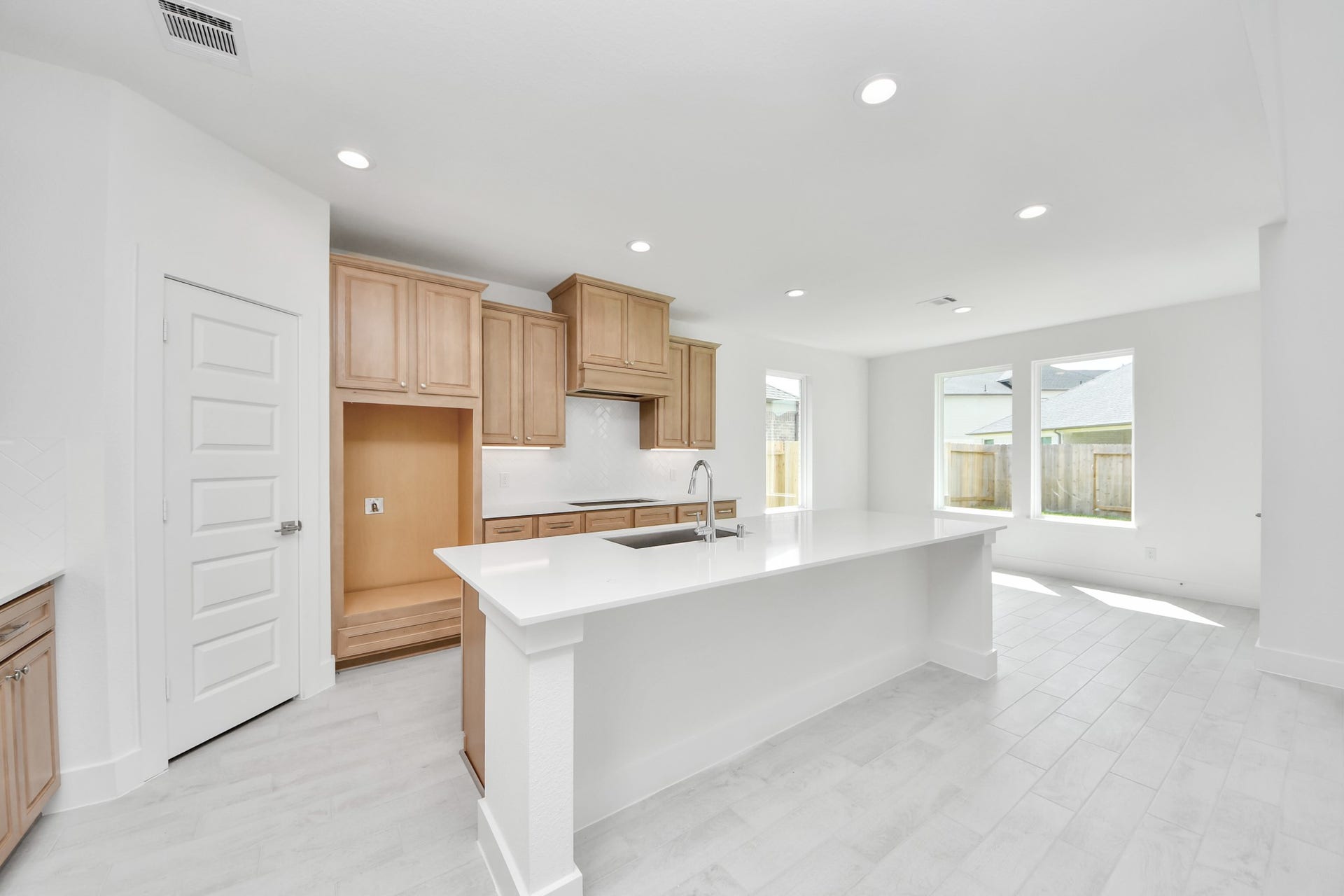 3221 Skerne Spring Drive, Spring, TX 77373 The kitchen is a culinary haven, featuring granite countertops, a tile backsplash, stainless steel appliances, 42 upper cabinets, and undercabinet lighting. Sample photo of completed home with similar floor plan. Actual colors and selections may vary.