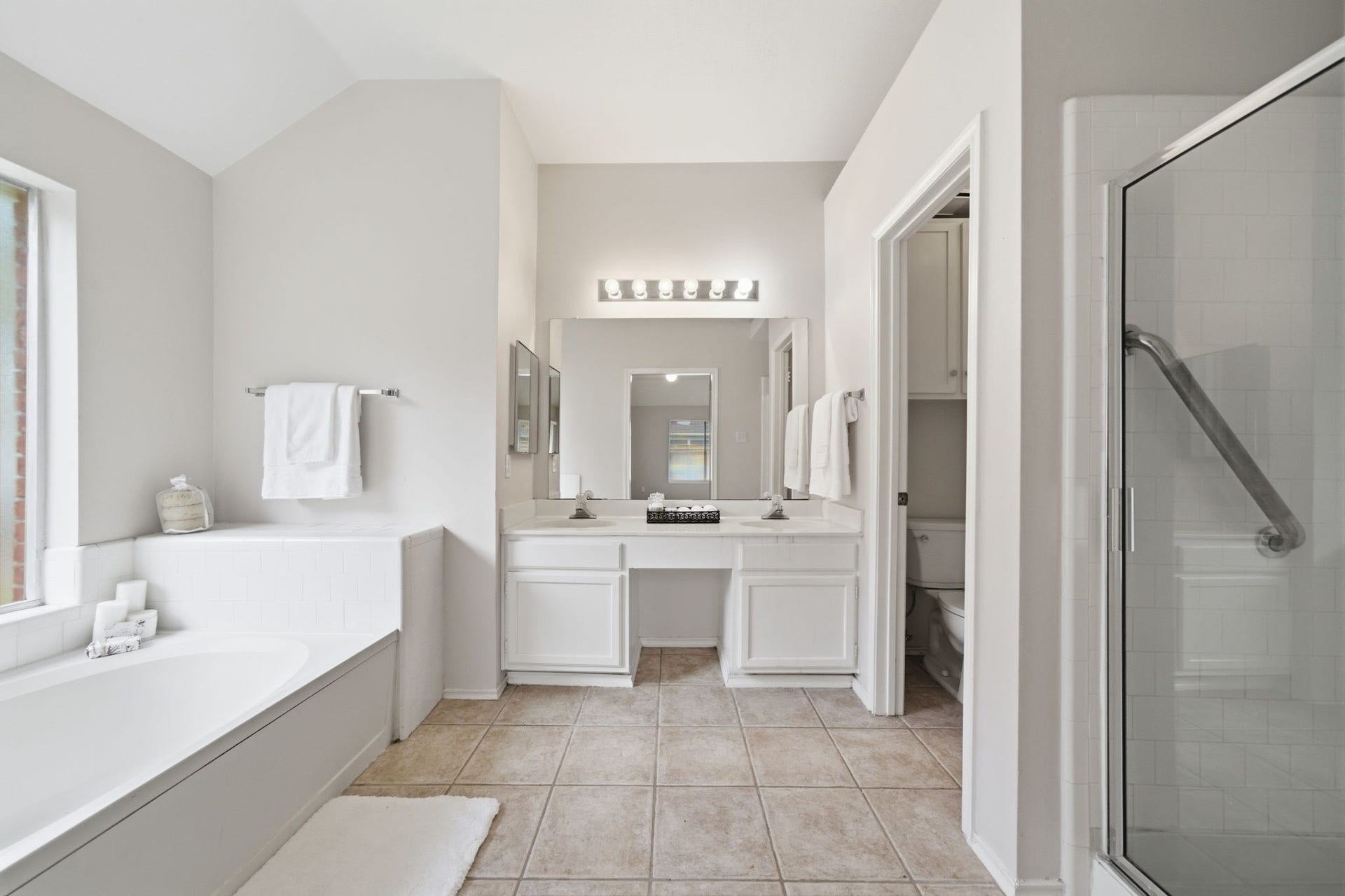 707 Laurel Grove Lane, Pearland, TX 77584 Primary bath with garden tub plus separate shower and double sink.