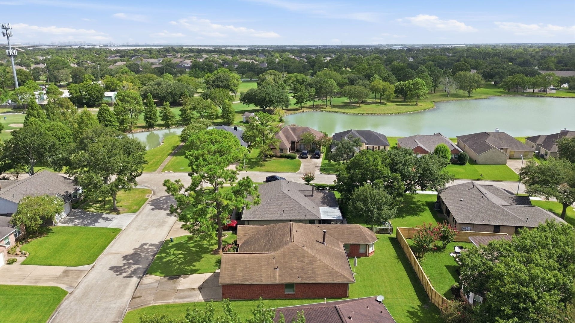 707 Laurel Grove Lane, Pearland, TX 77584 View of lake from front yard. Cul-de-sac street.